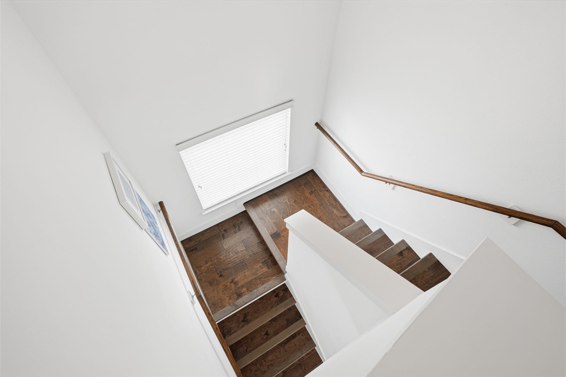 Engineered hardwood flooring continues up to the entire second floor.