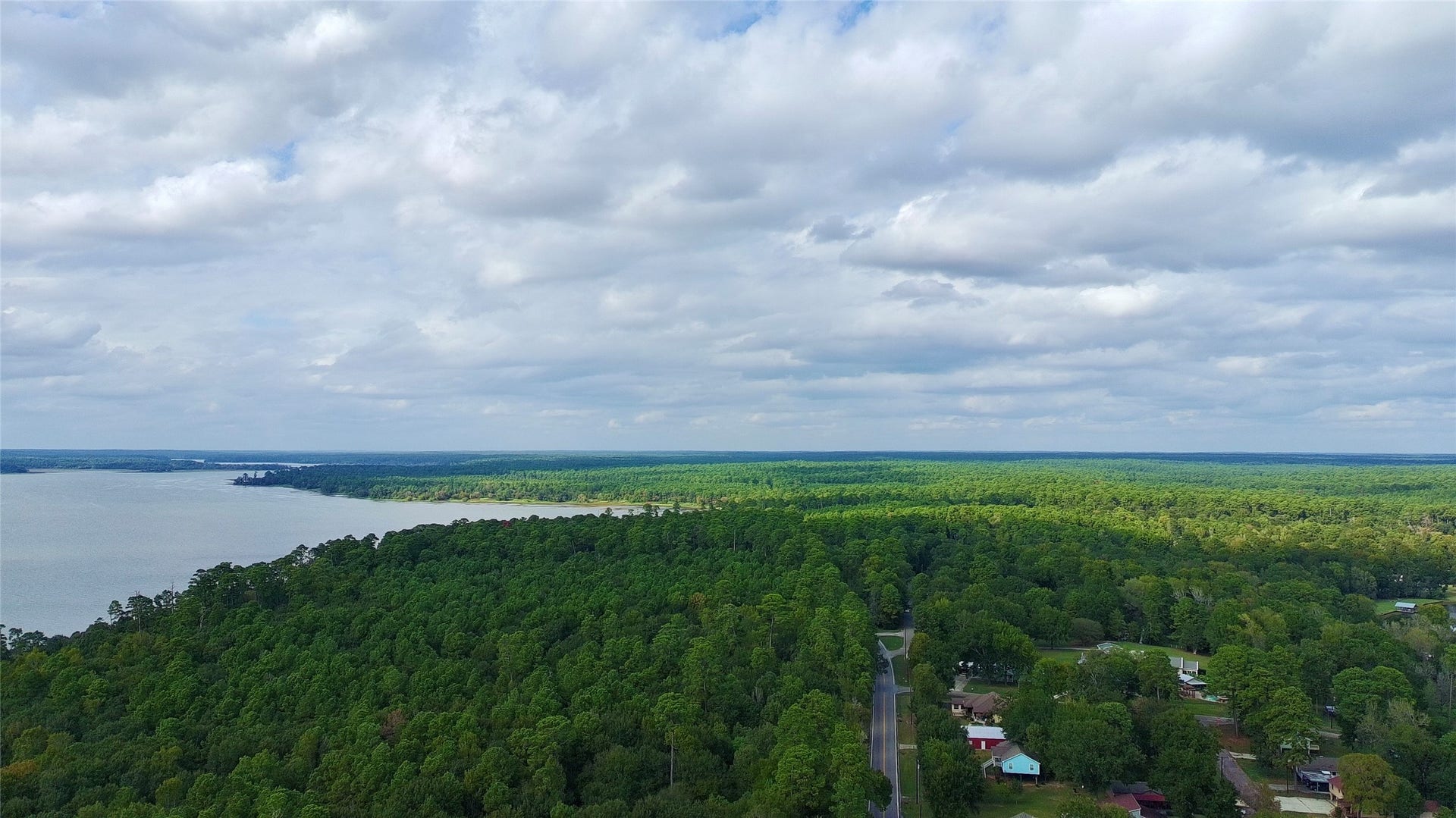 14335 Hill Drive, Willis, TX 77318 Lake Conroe right at your footsteps, property is located across the street from the Lake