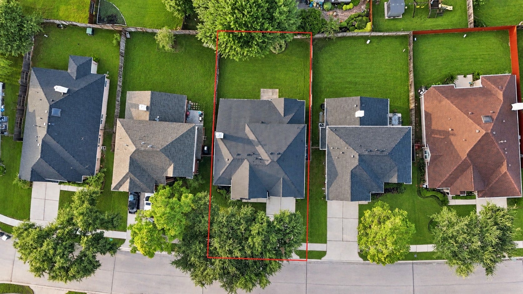 11404 Summit Bay Drive, Pearland, TX 77584 Aerial view showcases the home's desirable location within the established Shadow Creek Ranch neighborhood, highlighting the spacious backyard, neighboring homes, mature trees, and well-maintained residential setting. Roof about 2 years old! Amazing location!