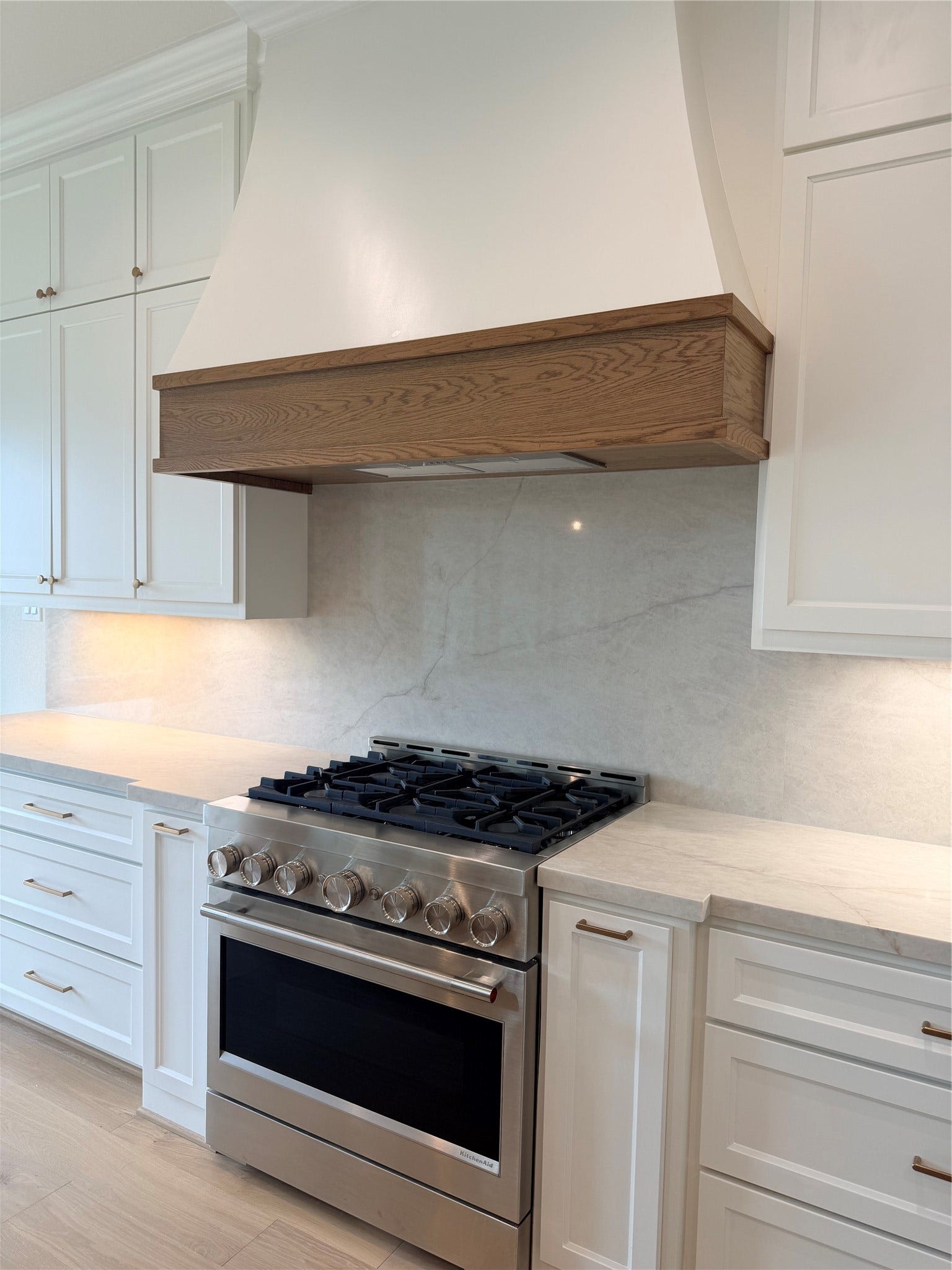 1727 South Pointe, Friendswood, TX 77546-5391 KitchenAid 6 Burner Range with white oak trimmed vent hood