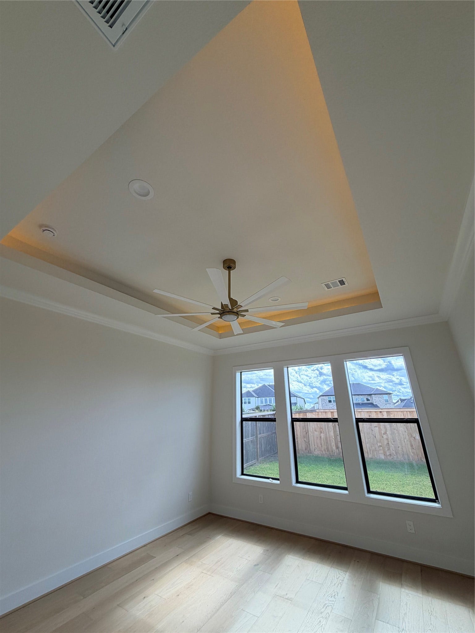 1727 South Pointe, Friendswood, TX 77546-5391 Primary Bedroom with wood floor upgrade and ceiling lighting treatment