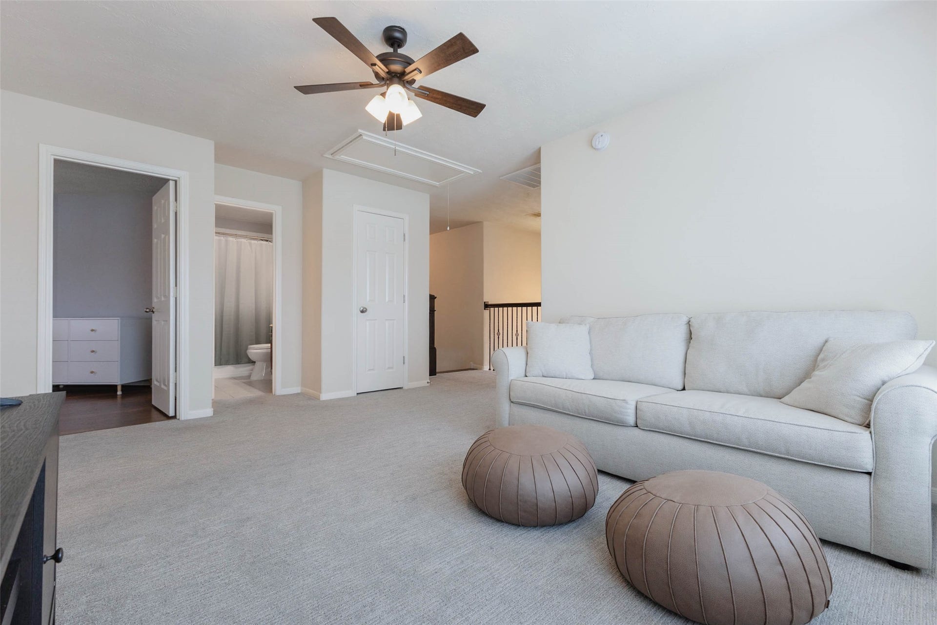 This angle highlights the game rooms connection to the surrounding upstairs rooms while showing just how much usable space the area provides. The open layout easily accommodates substantial furnishings without sacrificing comfortable circulation.