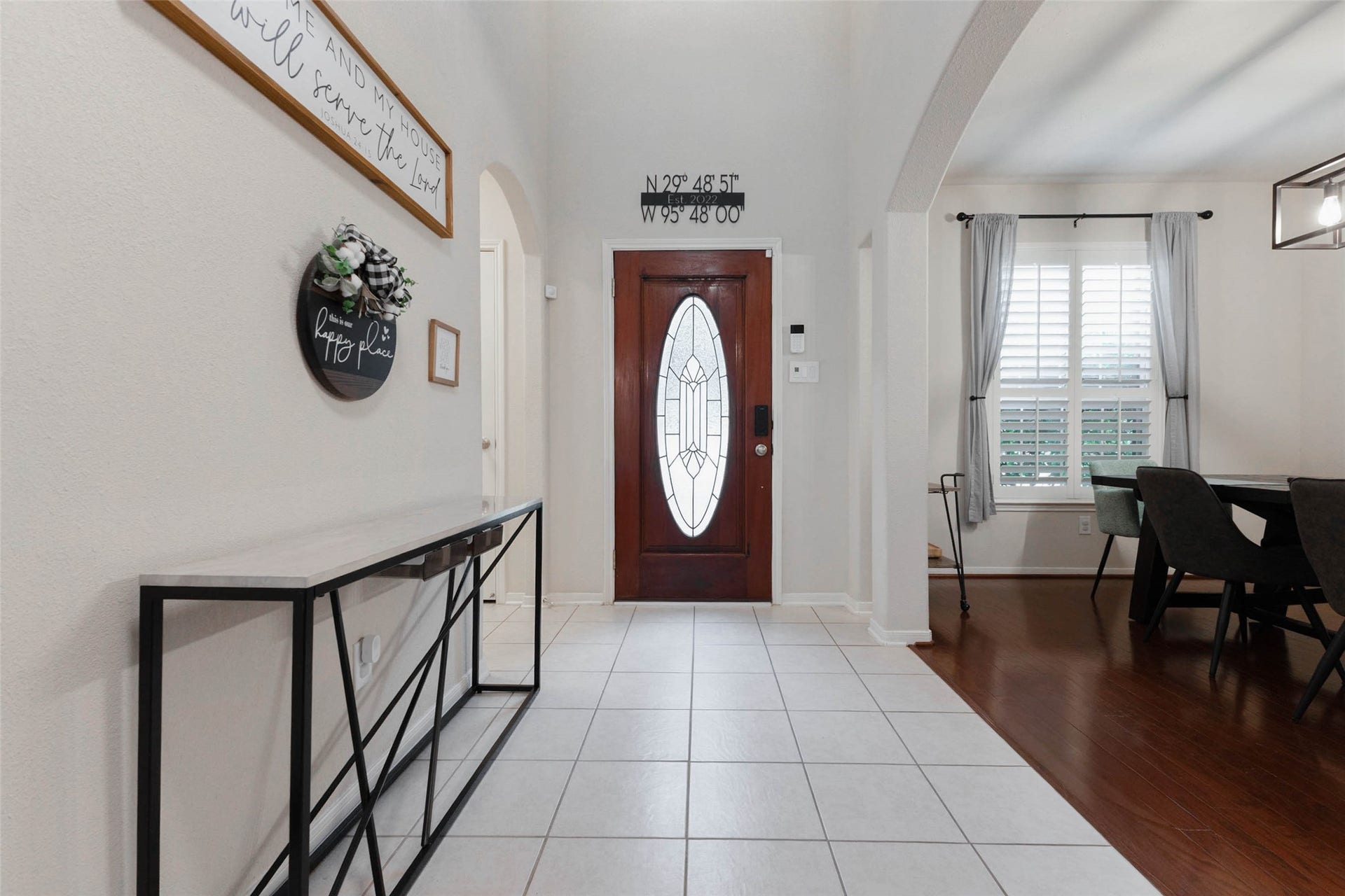 Looking back toward the front door, this perspective highlights the spacious entry and easy connection to the formal dining room.