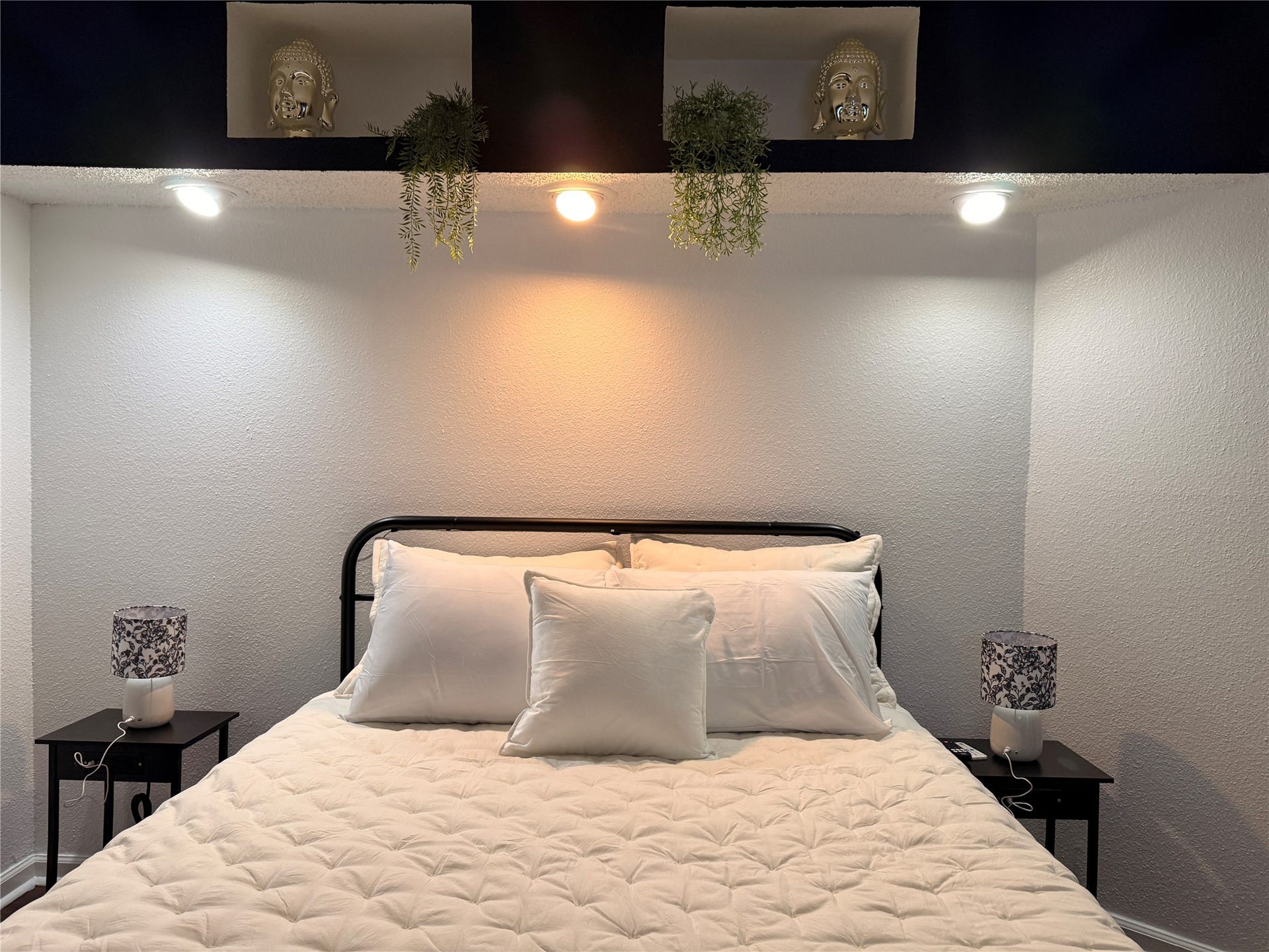 Soft lighting above the bed