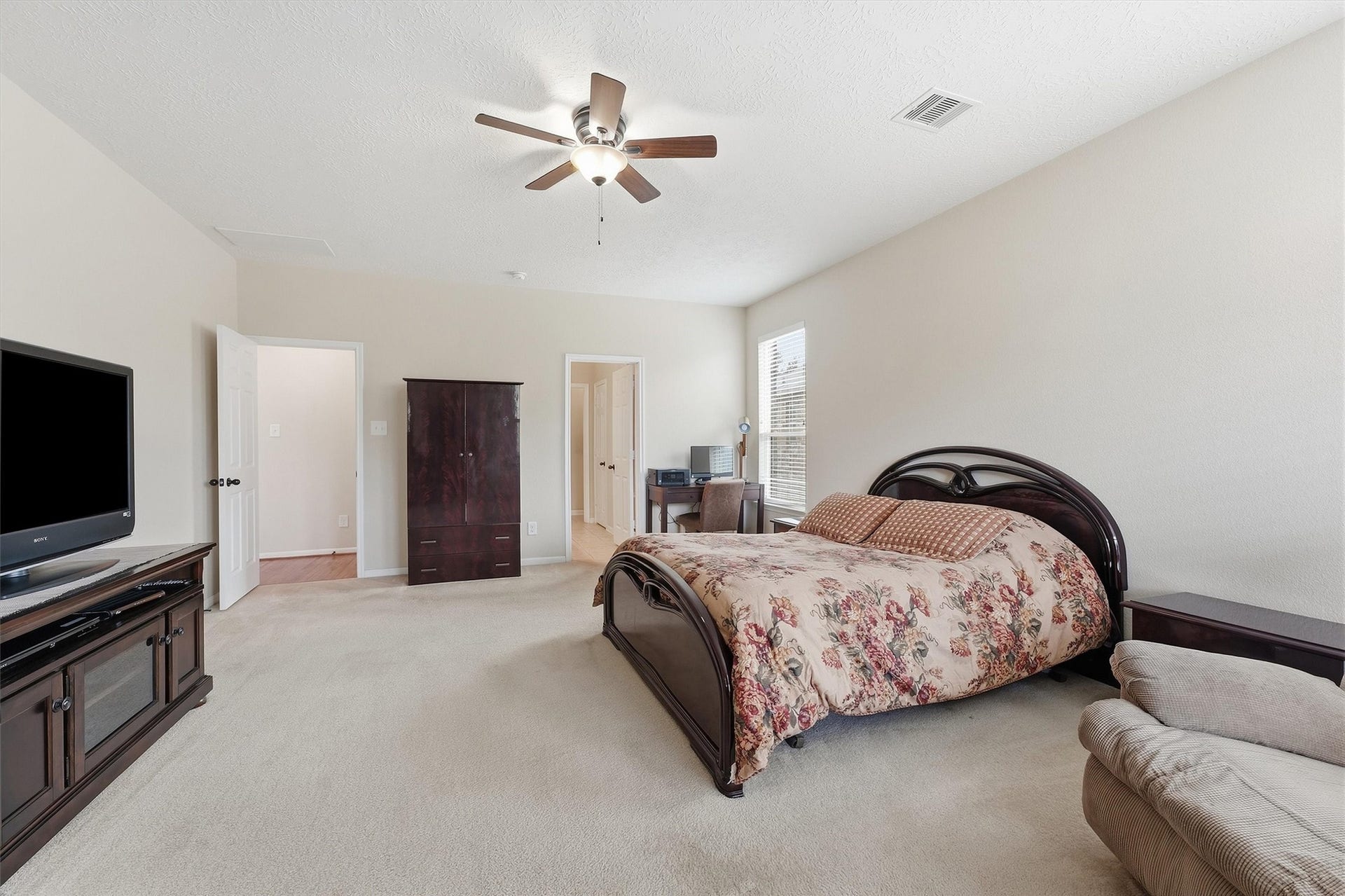 25522 Brentmoor Drive, Porter, TX 77365 Alternate view of the primary suite demonstrates its impressive scale, easily accommodating king-size furnishings, entertainment consoles, and a dedicated workspace or nursing corner.