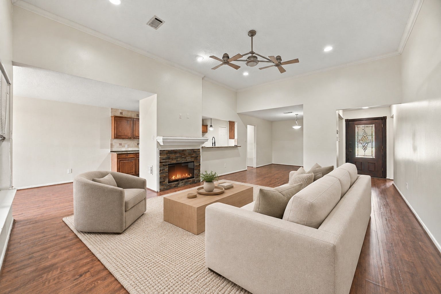 12902 Sandri Lane, Houston, TX 77077 High ceilings, crown molding, and recessed lighting give the main gathering space an airy feel. Virtually staged.