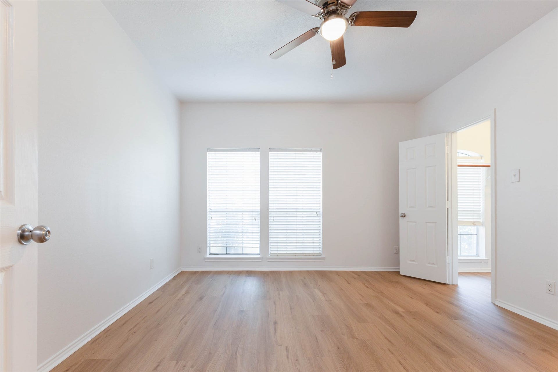6302 Briar Canyon Court, Katy, TX 77450 Beautifully refreshed, this generously sized first floor secondary bedroom features brand-new luxury vinyl plank flooring, crisp white walls, & a ceiling fan with lighting. Two large windows fill the room with natural light, while the open, airy layout easily accommodates a variety of bedroom furnishings.*