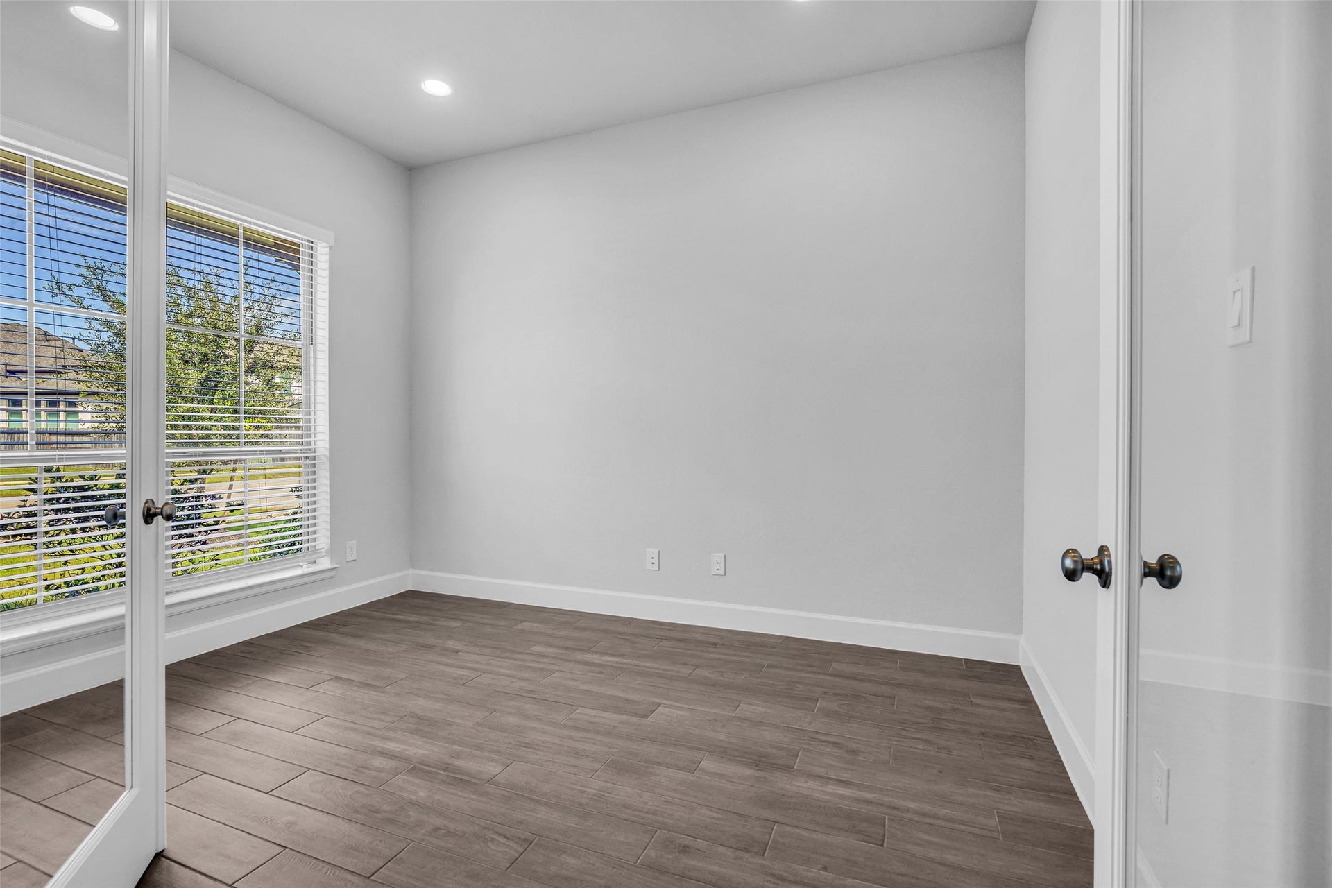 2215 Carrol Creek Drive, Richmond, TX 77469 Enclosed den or home office located at the front of the property