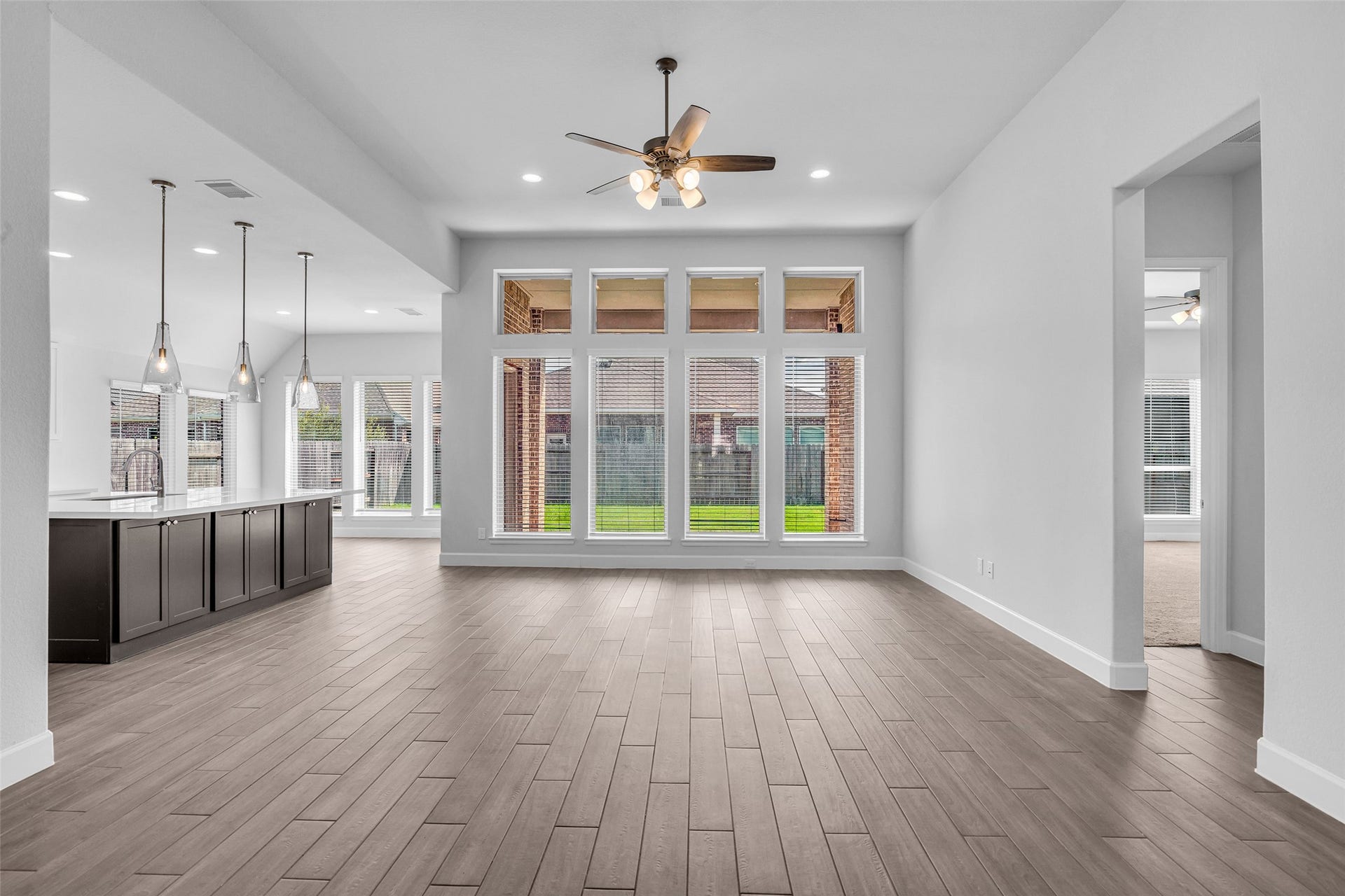 2215 Carrol Creek Drive, Richmond, TX 77469 Spacious living room with floor to ceiling windows