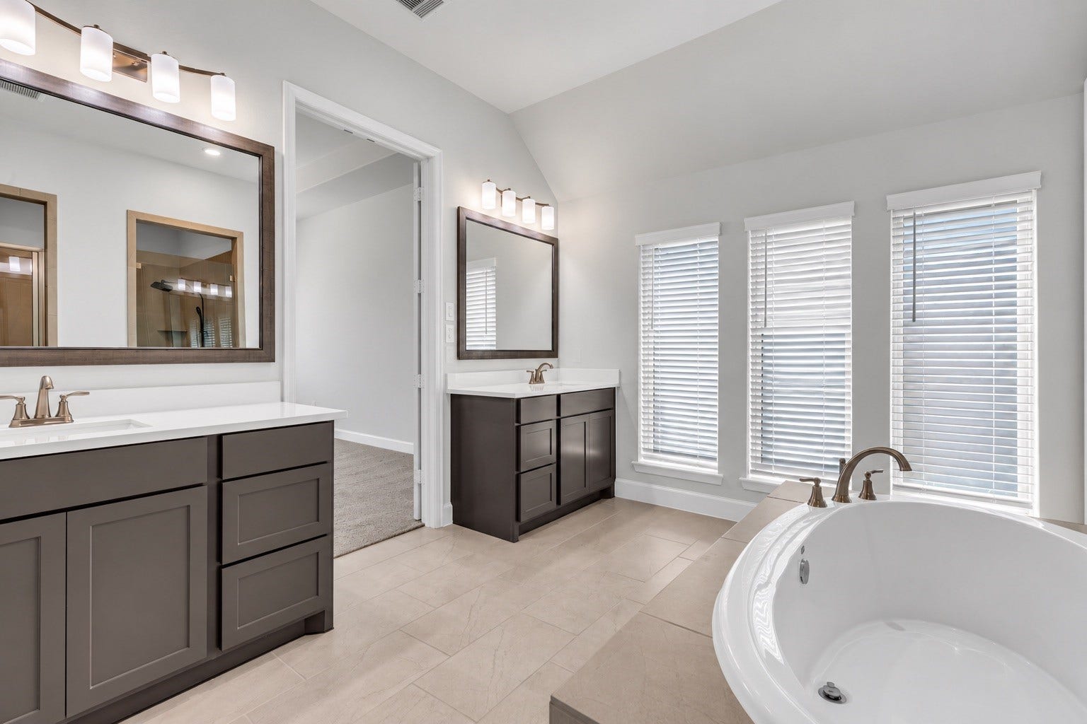 2215 Carrol Creek Drive, Richmond, TX 77469 Framed mirrors and seperate sink areas