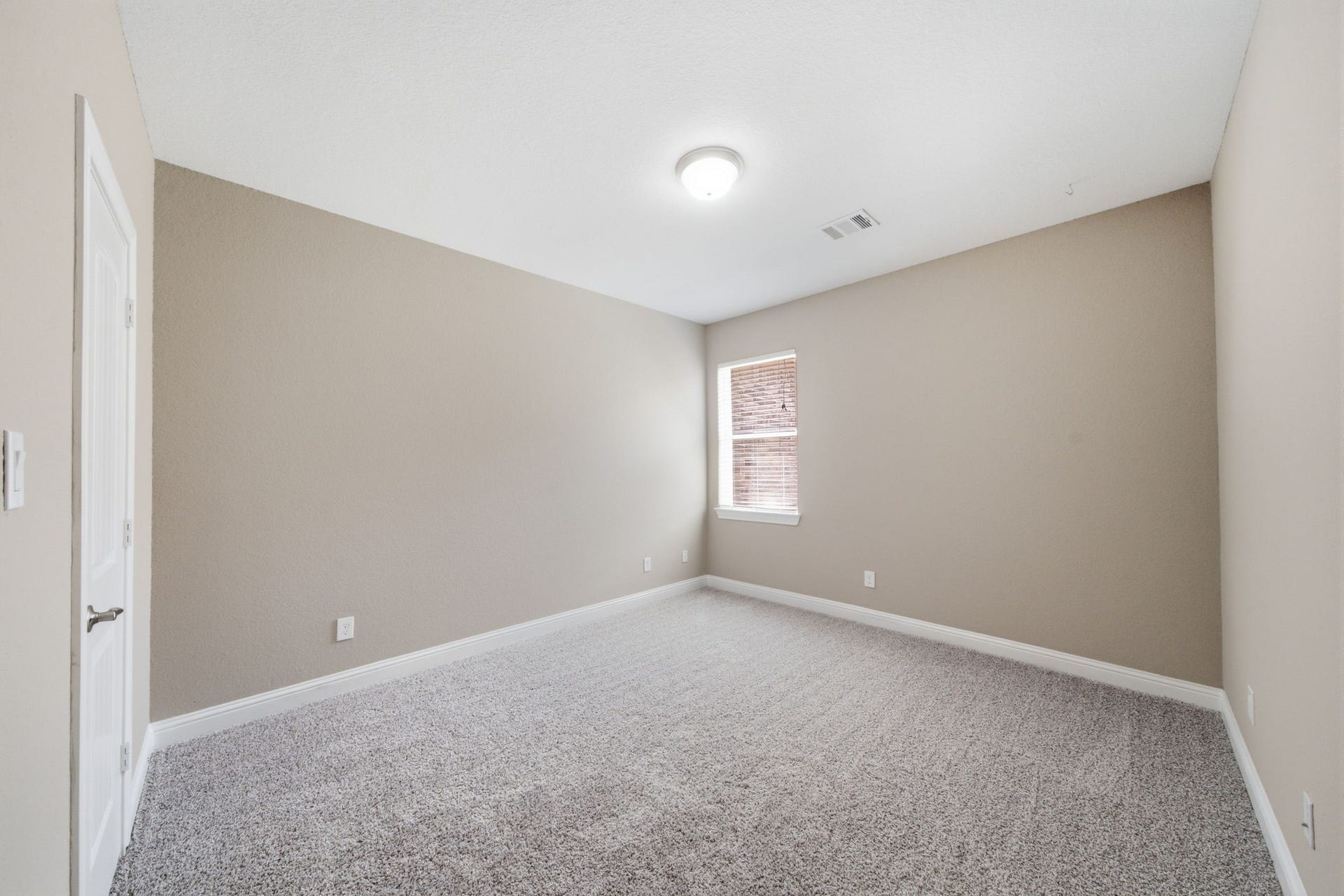 18818 Wichita Trail, Magnolia, TX 77355 A well-proportioned layout allows for easy furniture placement in this secondary bedroom with plush carpet flooring and neutral paint. A window provides natural light, while the versatile space easily adapts to a guest suite or creative play area.