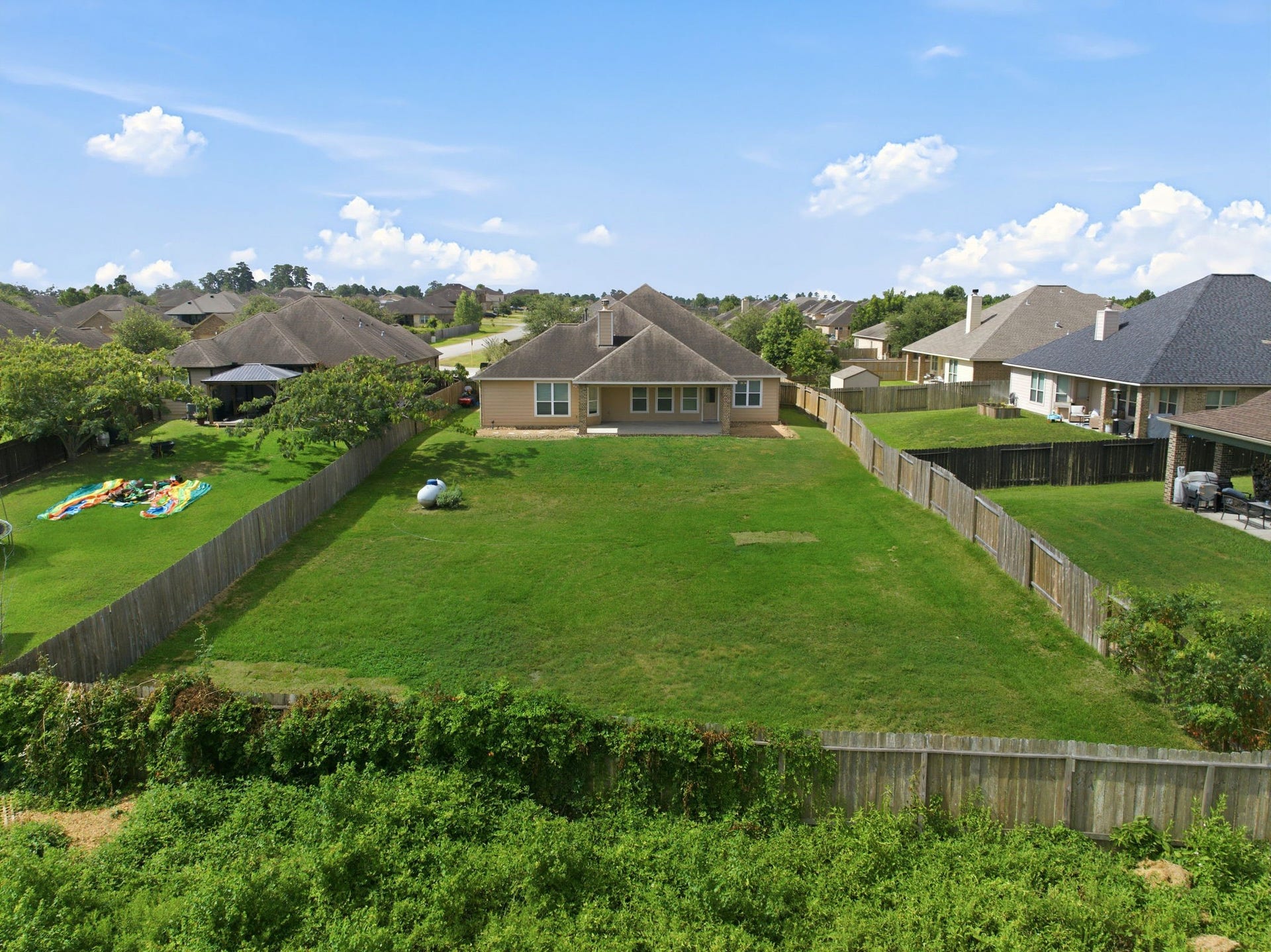 18818 Wichita Trail, Magnolia, TX 77355 Oversized lot features an expansive, private fenced yard with no back neighbors, offering endless space for a pool or a lush garden.