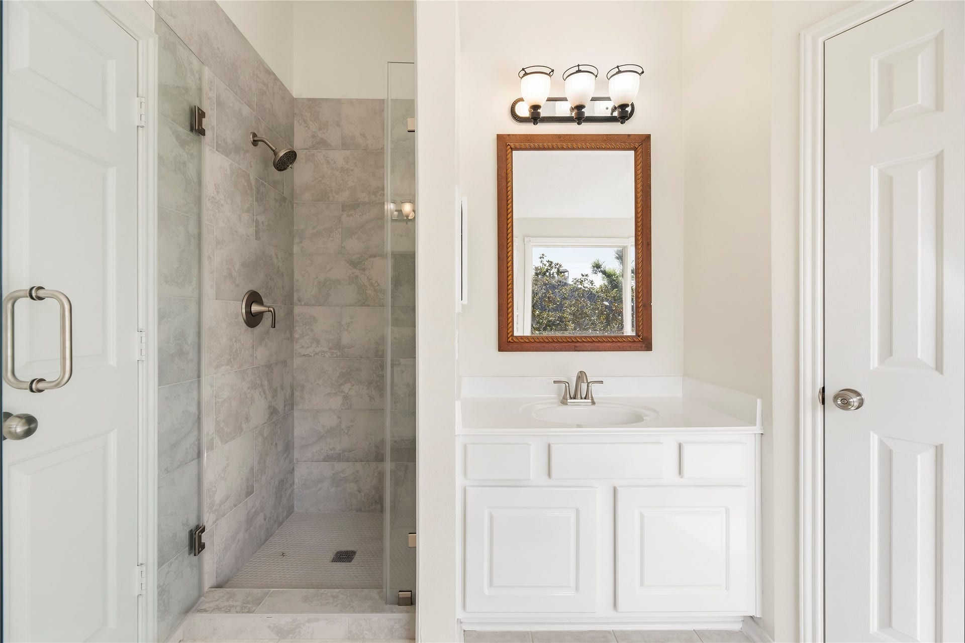 3422 Powell Way, Missouri City, TX 77459 Fully remodeled shower with beautiful tile work and new fixtures.