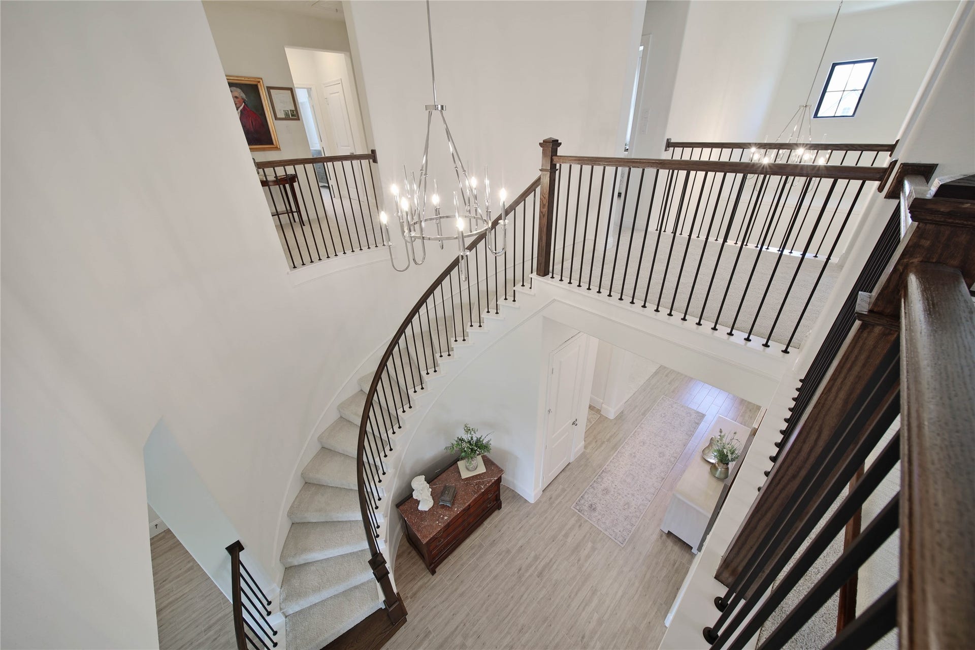 A winding staircase leads to the second floor, adding a touch of elegance as you make your way upstairs.