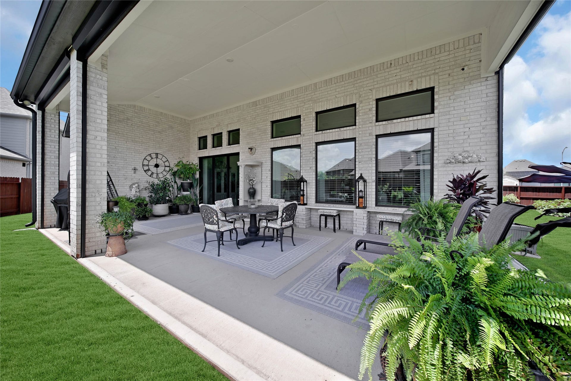 The extended patio offers outdoor living at its finest and is plumbed for gas, providing the perfect opportunity to create a future outdoor kitchen.
