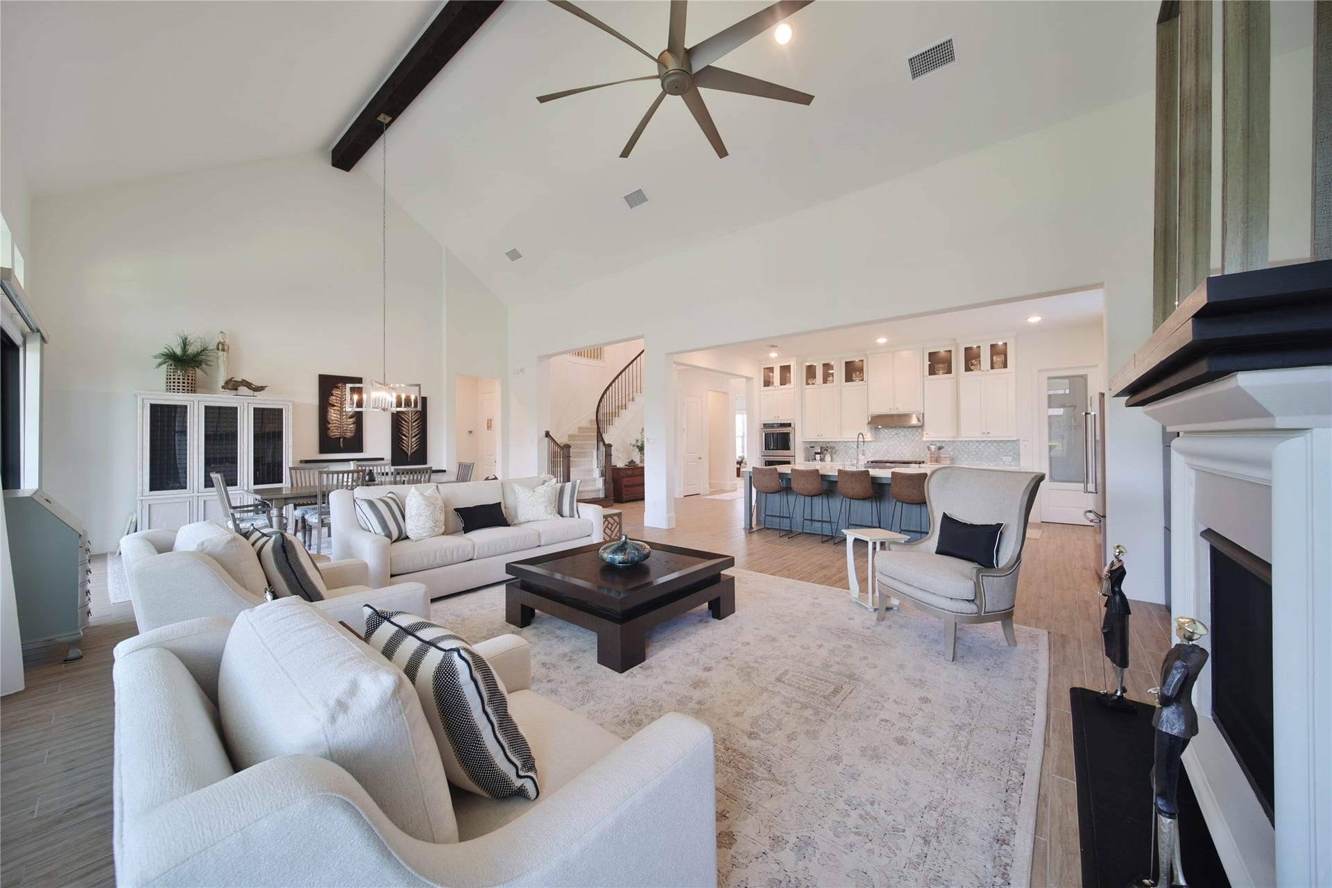 The open-concept floor plan creates a seamless flow between the living, dining, and kitchen areas, making everyday living and entertaining effortless.