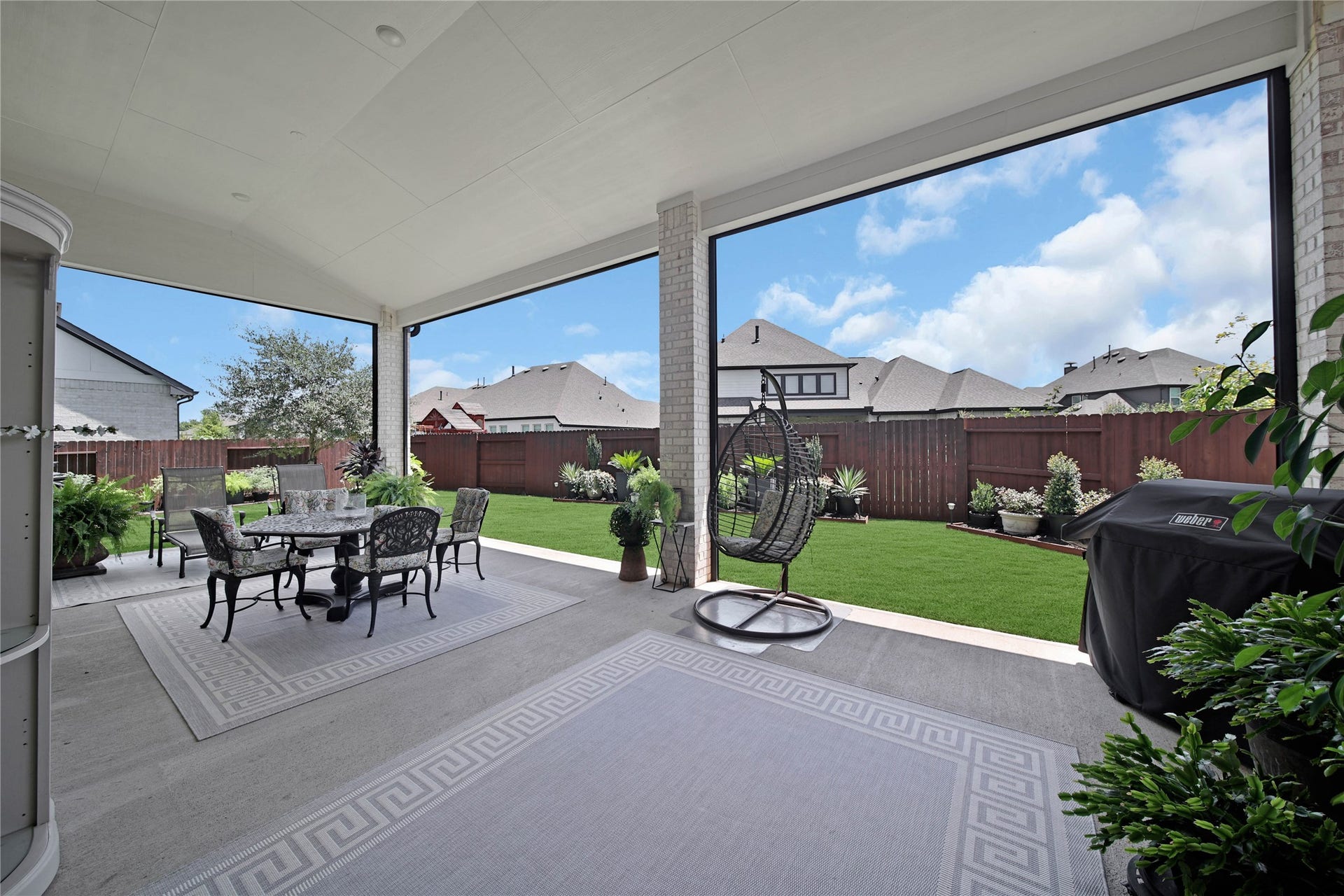 The extended covered patio invites you to step outside and enjoy even more space to relax, entertain, and make lasting memories.