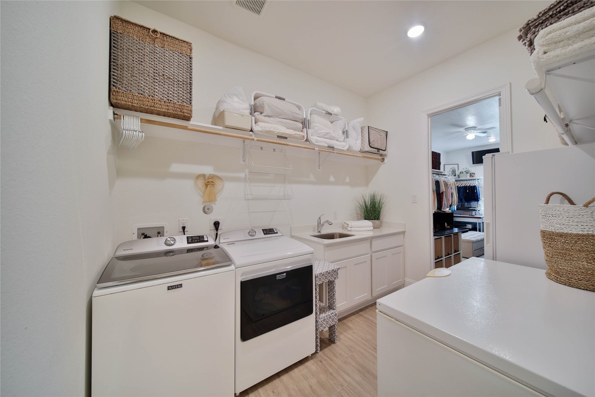 A fabulous feature of the home is the direct access from the primary closet to the utility rooman incredibly convenient design that makes laundry day a breeze!