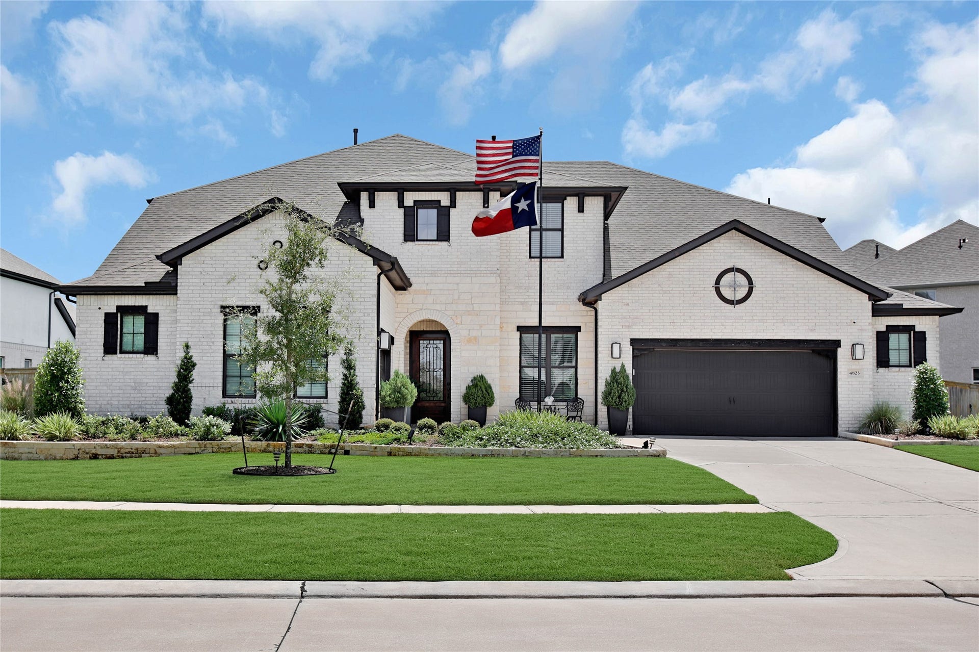 Welcome home to 4823 Creekbend Dr. From the moment you arrive, this stunning residence makes an unforgettable first impression with its inviting curb appeal, thoughtful design, and exceptional spaces inside and out!