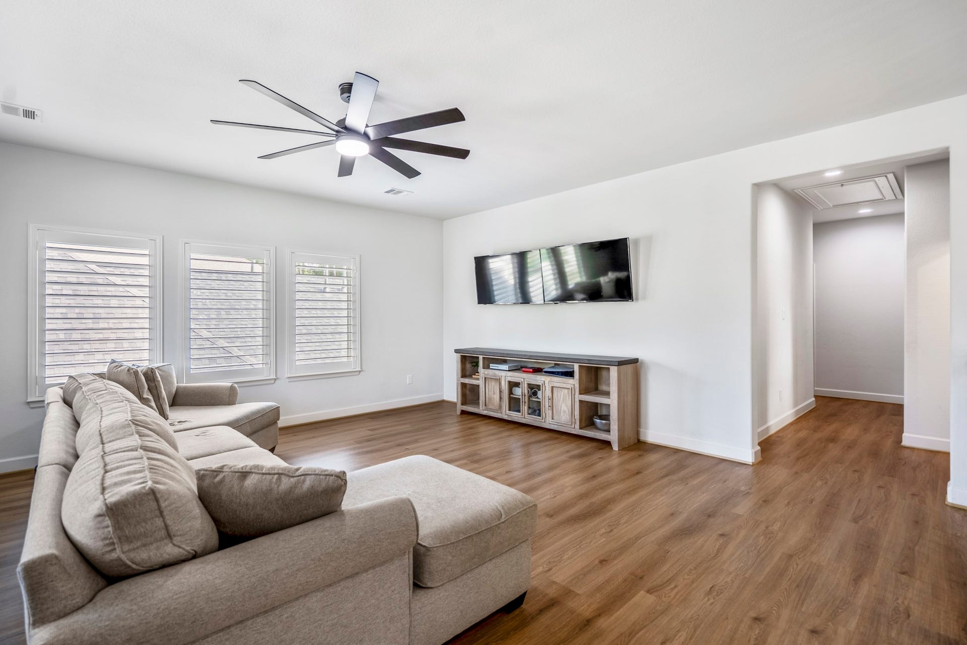 304 Mullins Court, Montgomery, TX 77316 Ample natural light beams through the 2nd level living space showcasing upgraded LVP flooring throughout.