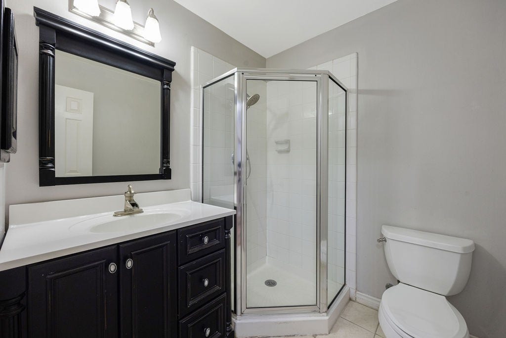 A full bath on the first floor, complete with walk in shower.