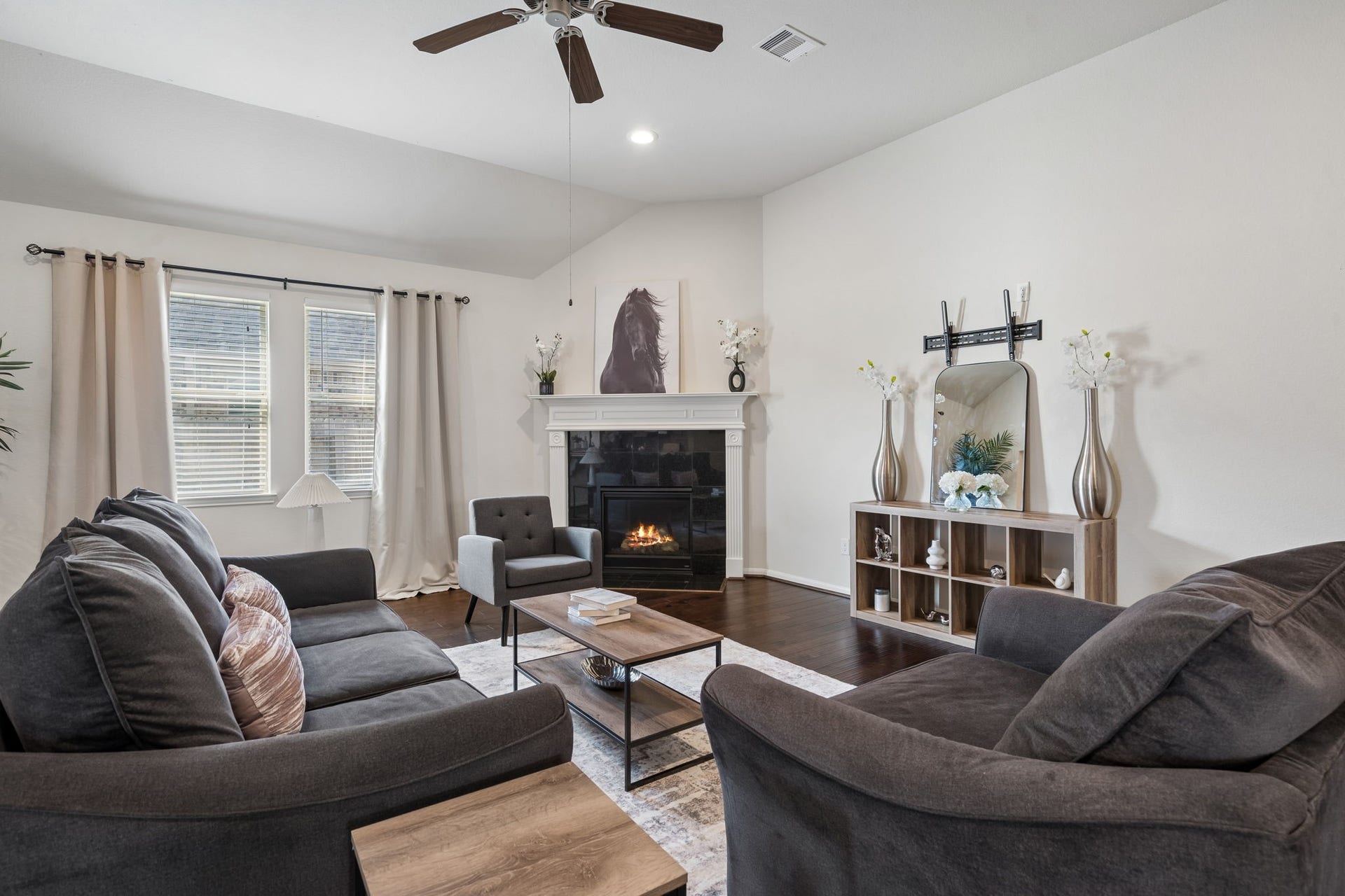 422 Stockport Drive, League City, TX 77573 Large open living room with fireplace & large window.