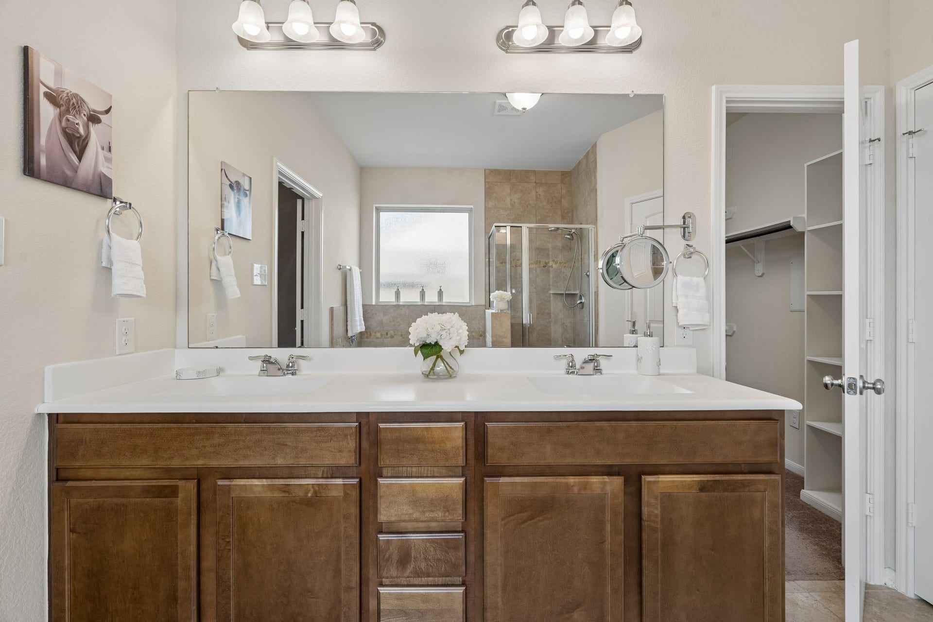 422 Stockport Drive, League City, TX 77573 Just beyond the vanity, a spacious walk-in closet with built-in shelving