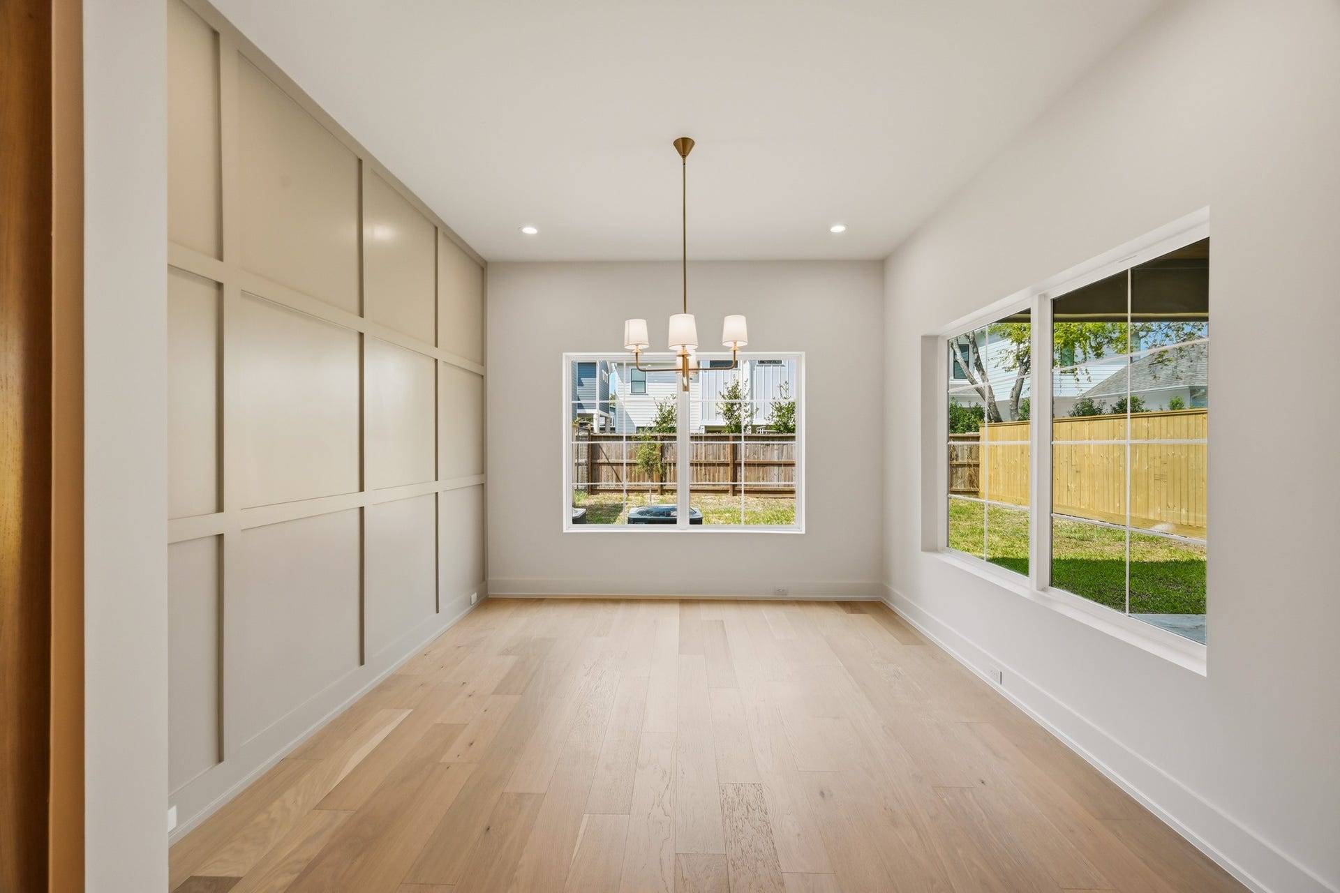 The dining room overlooks the backyard and covered patio!