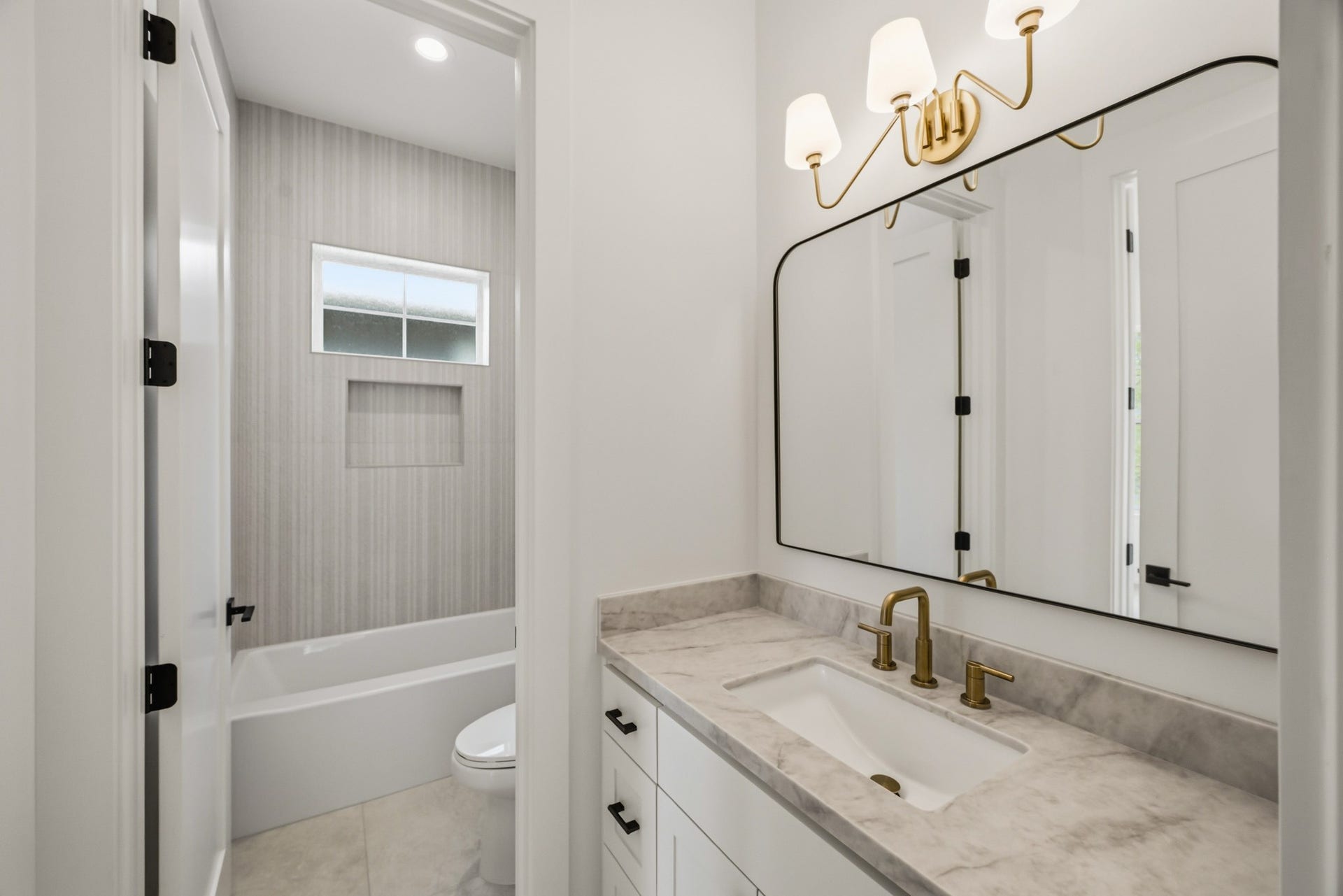 This full bath serves both the game room and bedroom 2!