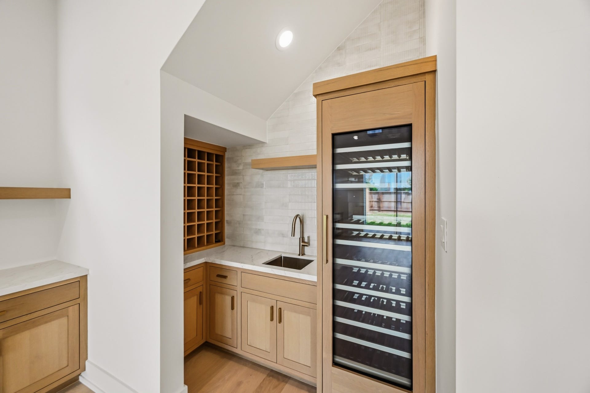 The wet bar features both chilled and unchilled wine storage!