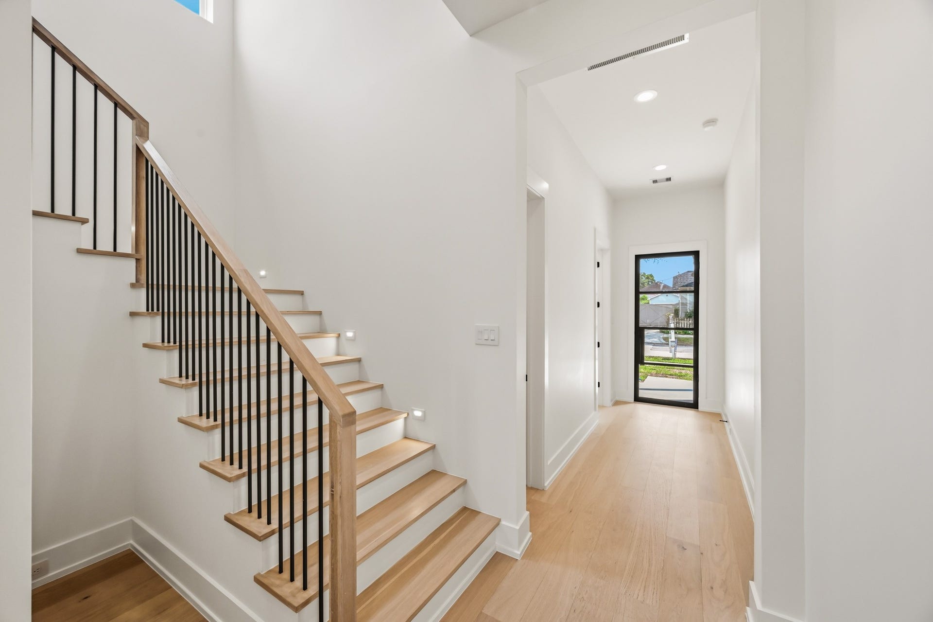 The stair hall is awash in natural light from 2nd story windows!