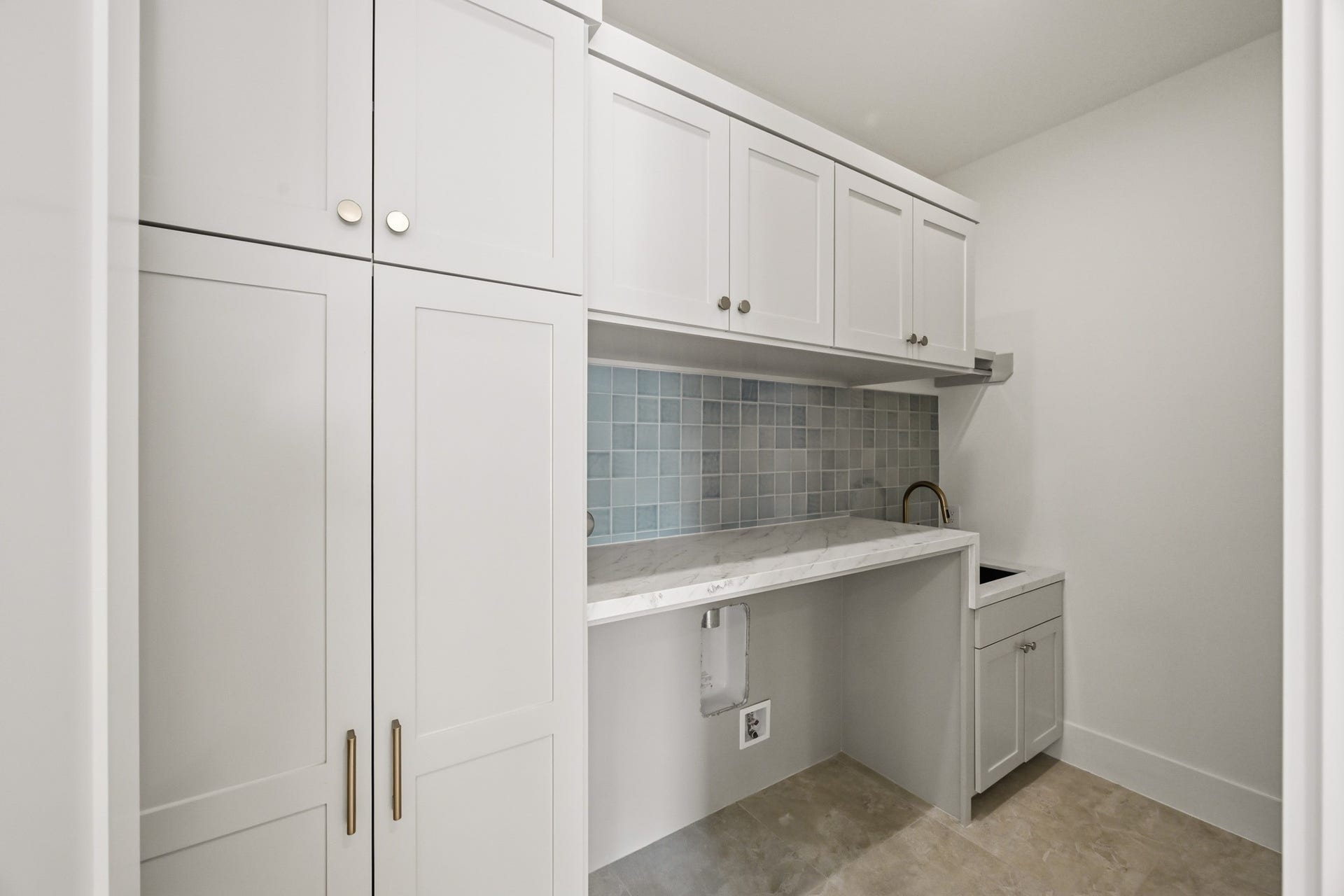 Off the game room is a well appointed utility room!