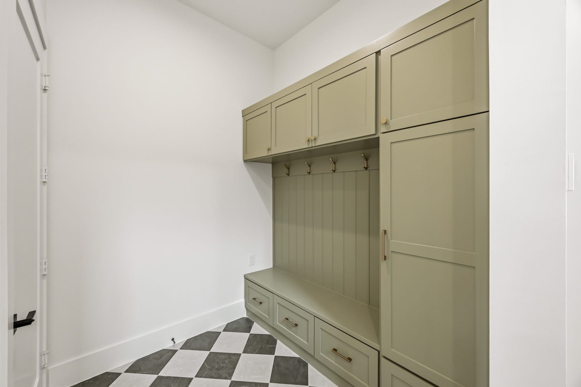From the garage, you'll enter this spacious and well-appointed mudroom!