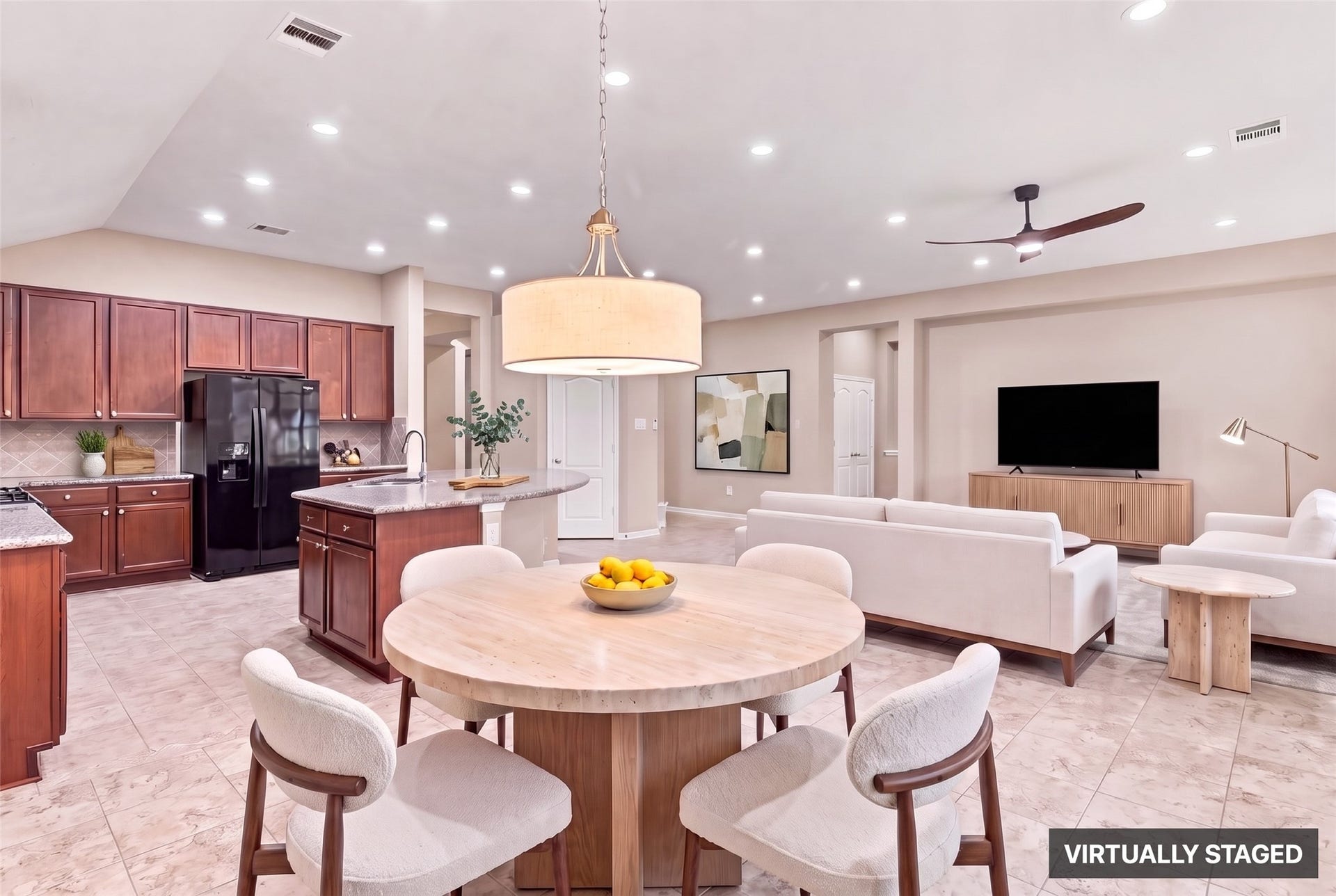 24015 Orange Orchard Lane, Katy, TX 77493 Virtually staged. Breakfast area between the kitchen and family room - the everyday table that keeps the formal dining room for occasions.