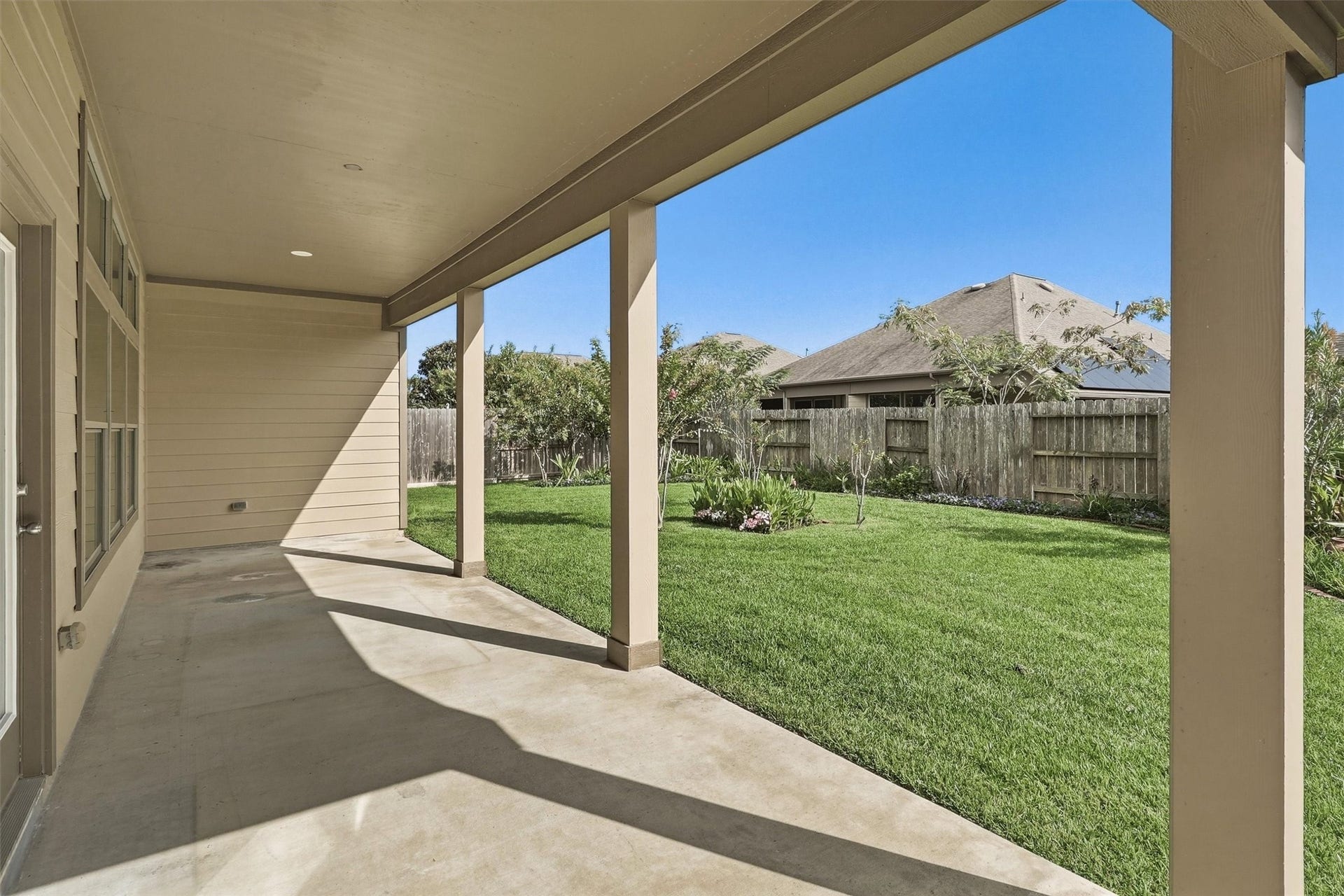 24015 Orange Orchard Lane, Katy, TX 77493 Recessed lighting under the patio ceiling keeps the space usable well after sunset.