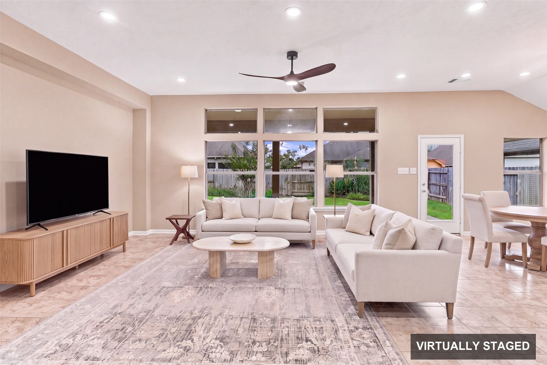24015 Orange Orchard Lane, Katy, TX 77493 Virtually staged. A door off the family room opens straight onto the covered patio, keeping indoor and outdoor living a single step apart.