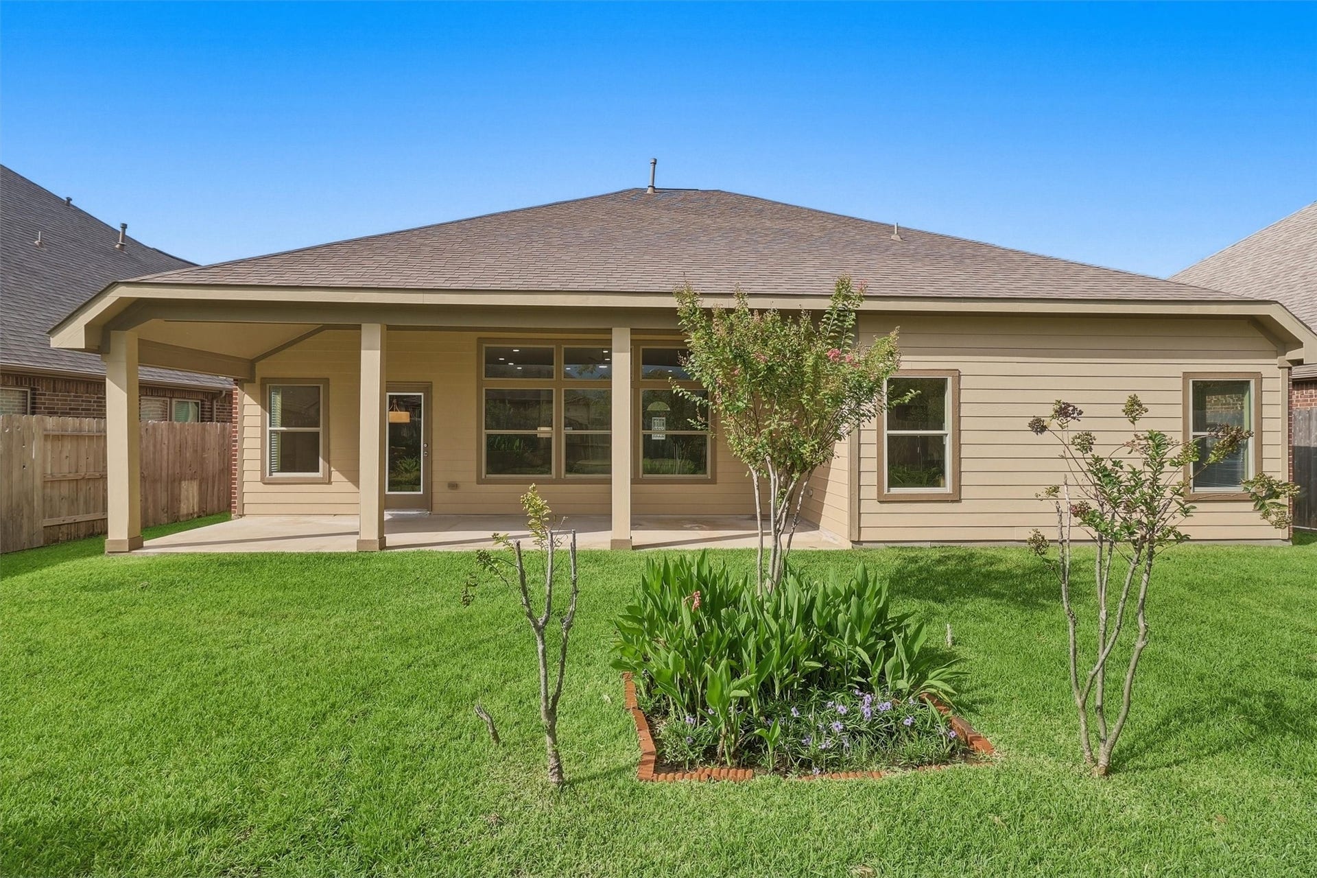 24015 Orange Orchard Lane, Katy, TX 77493 A wide, open lawn behind a wood privacy fence - room to play, garden or entertain.