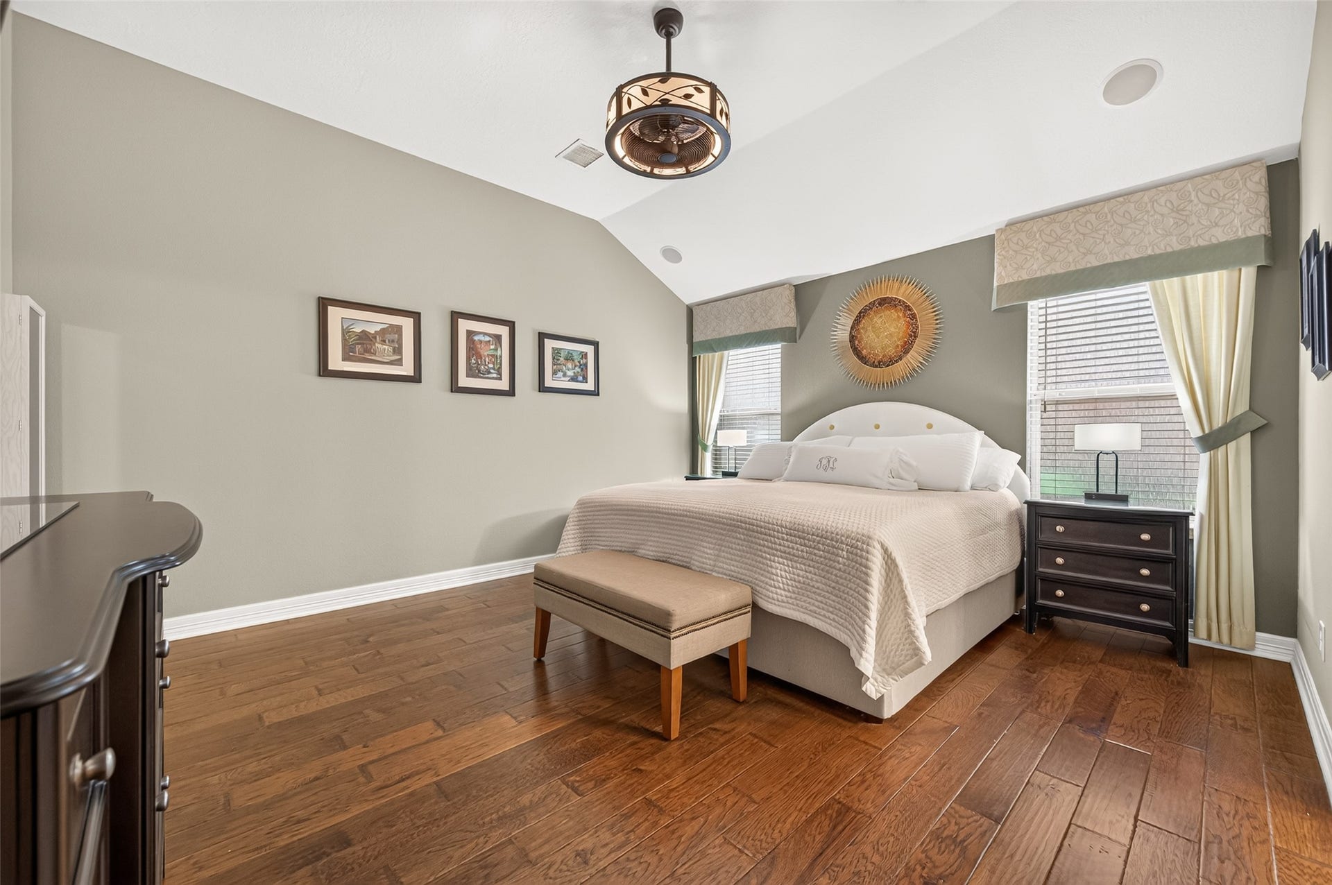 211 Little Summer Drive, Rosenberg, TX 77469 Relax in the primary retreat, with a vaulted ceiling, rich hardwood floors and soft light from two windows.