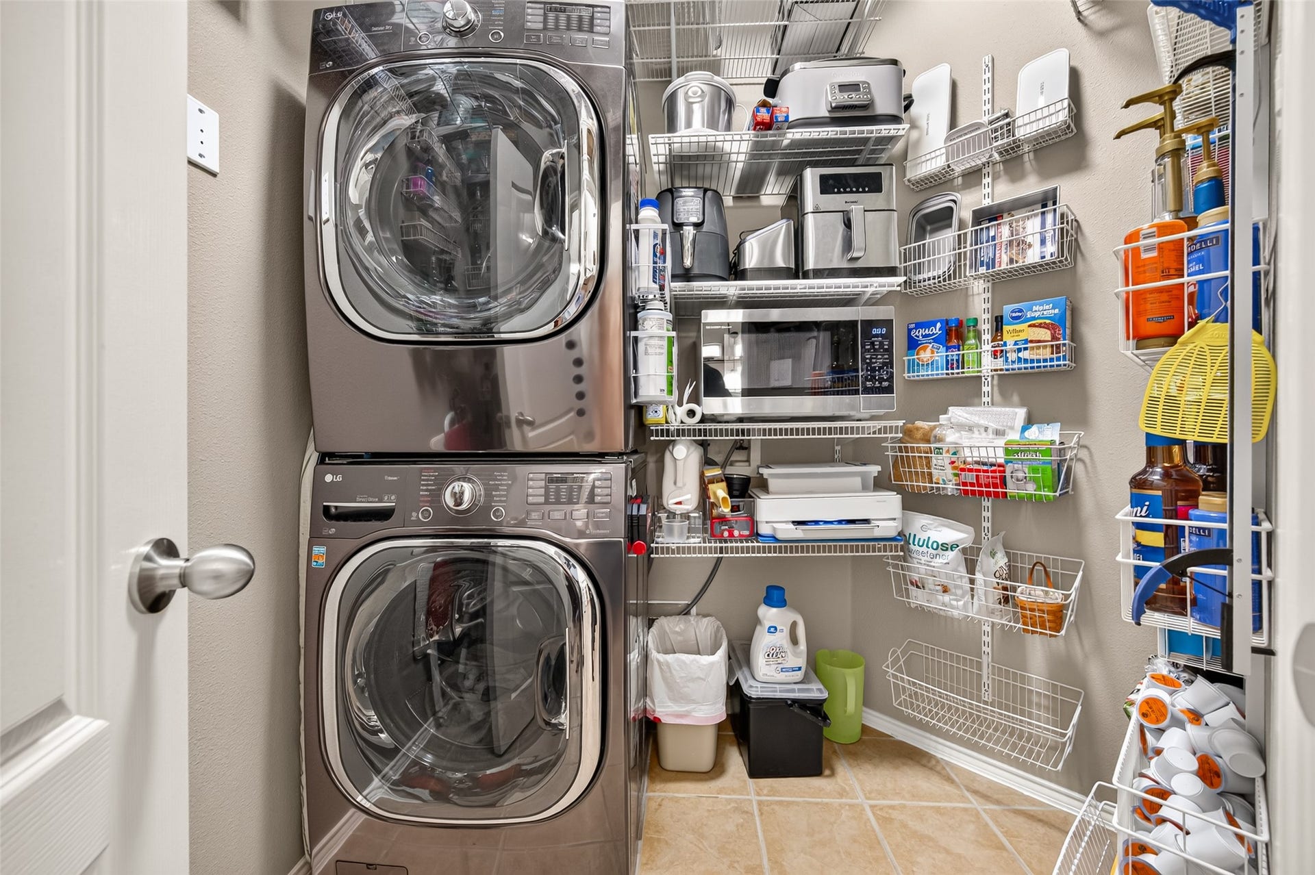 211 Little Summer Drive, Rosenberg, TX 77469 Utility room with added custom shelving - washer and dryer stay with the home.