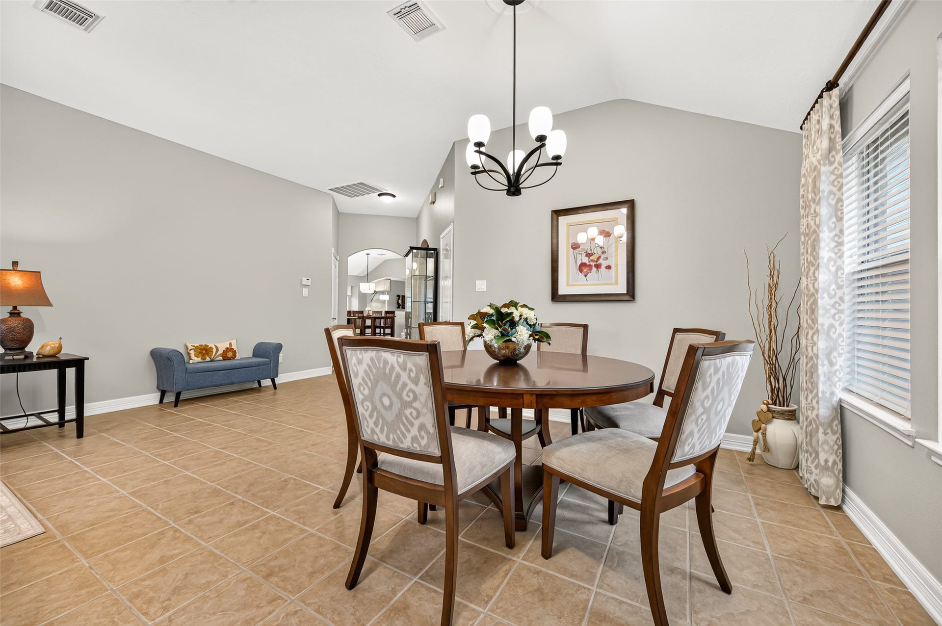 211 Little Summer Drive, Rosenberg, TX 77469 Formal dining room with an updated light fixture and custom drapes - plenty of room for holiday dinners!
