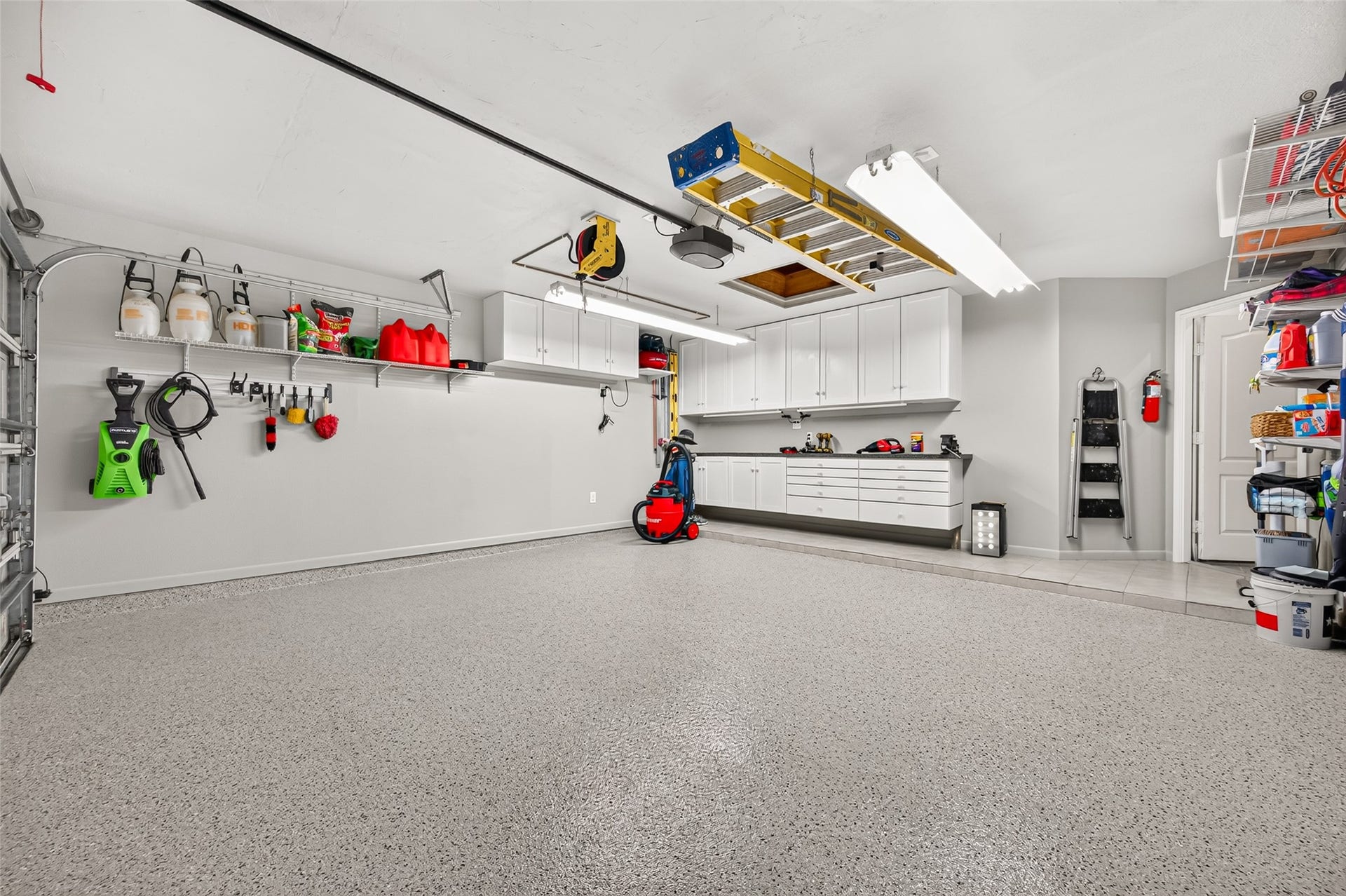 211 Little Summer Drive, Rosenberg, TX 77469 Recently updated garage with epoxy floors, freshly painted drywall, baseboards, built-in cabinets and added electrical outlets.