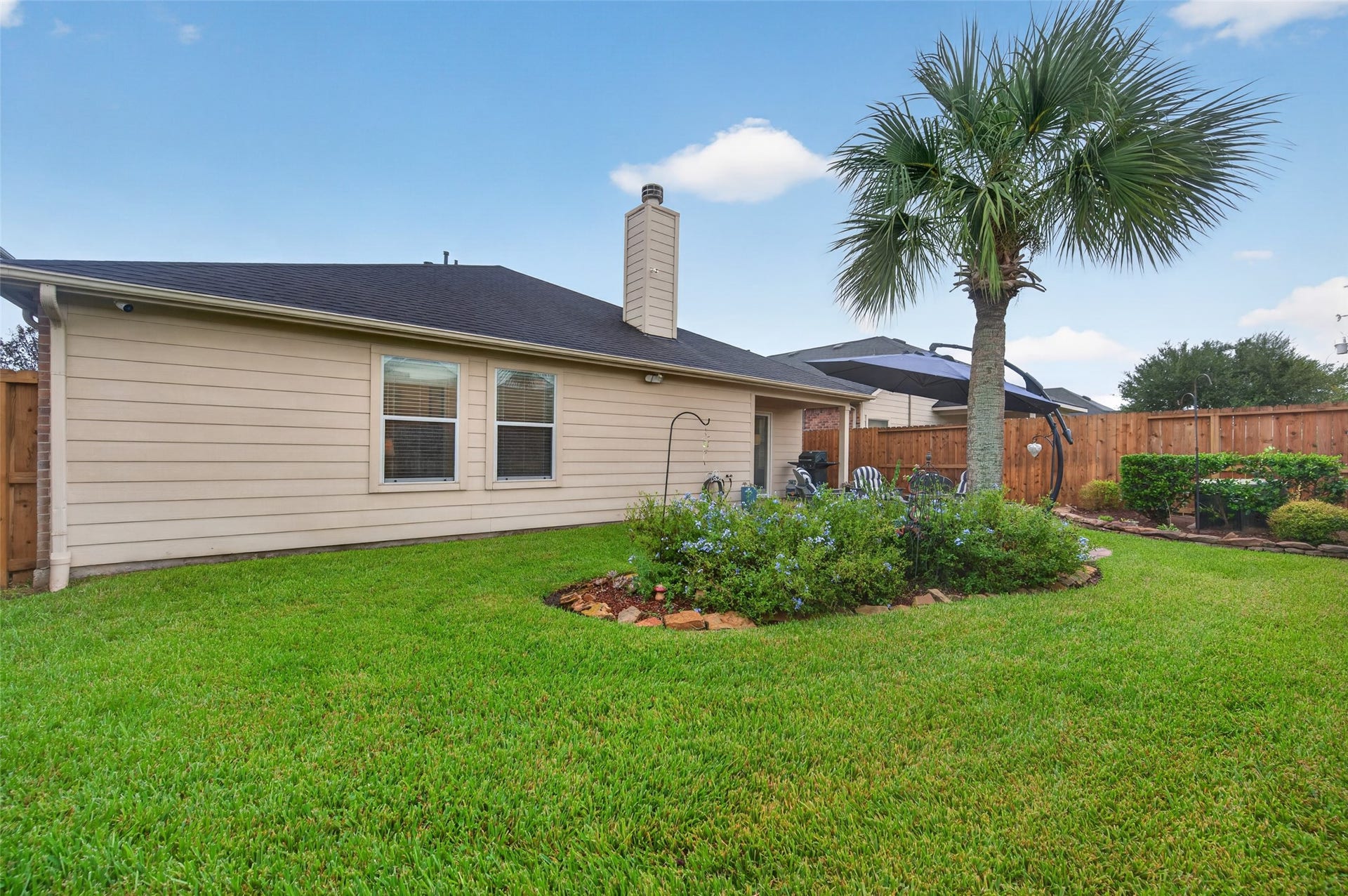 211 Little Summer Drive, Rosenberg, TX 77469 Backyard with French drains and a sprinkler system.