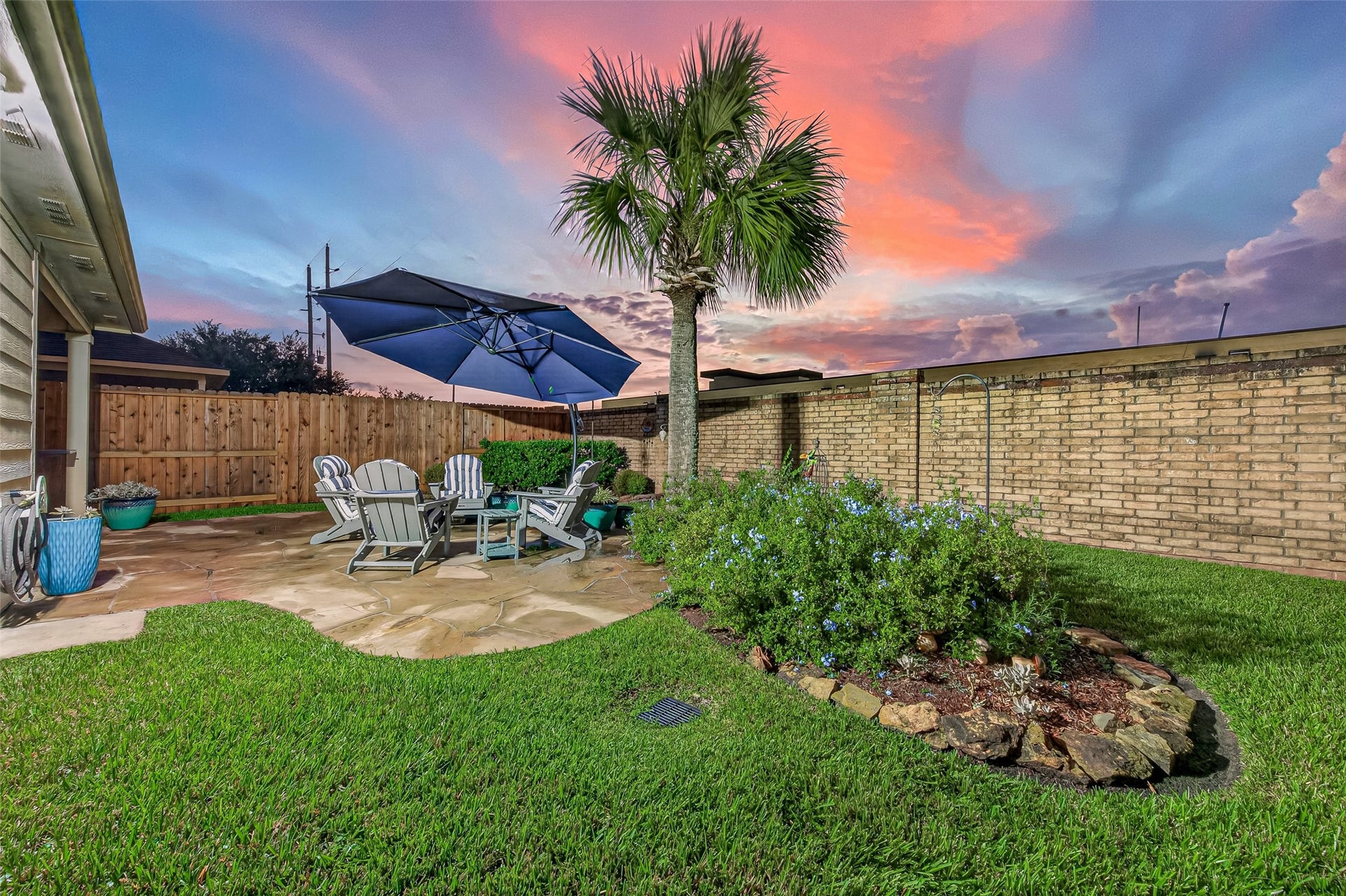 211 Little Summer Drive, Rosenberg, TX 77469 Fully fenced backyard with landscaped beds - privacy fence replaced June 2026.