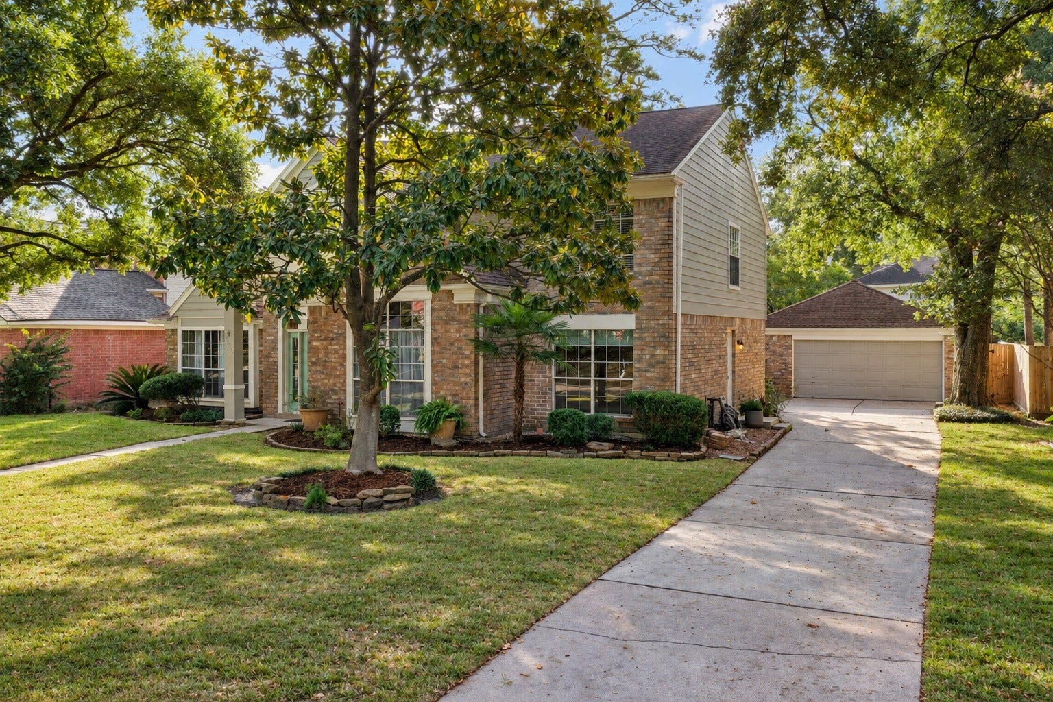 2631 Woodsboro Drive, Spring, TX 77388 The manicured lawn and landscaping enhance the property's curb appeal, while a spacious driveway leads to a detached garage.