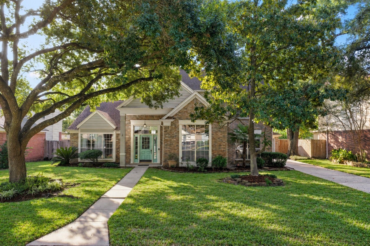 2631 Woodsboro Drive, Spring, TX 77388 Front yard photo set further back to capture the mature trees.