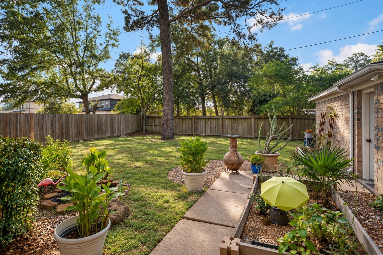 2631 Woodsboro Drive, Spring, TX 77388 Discover a spacious backyard oasis, complete with lush greenery, mature trees, and a charming patio area ideal for relaxation and outdoor gatherings.