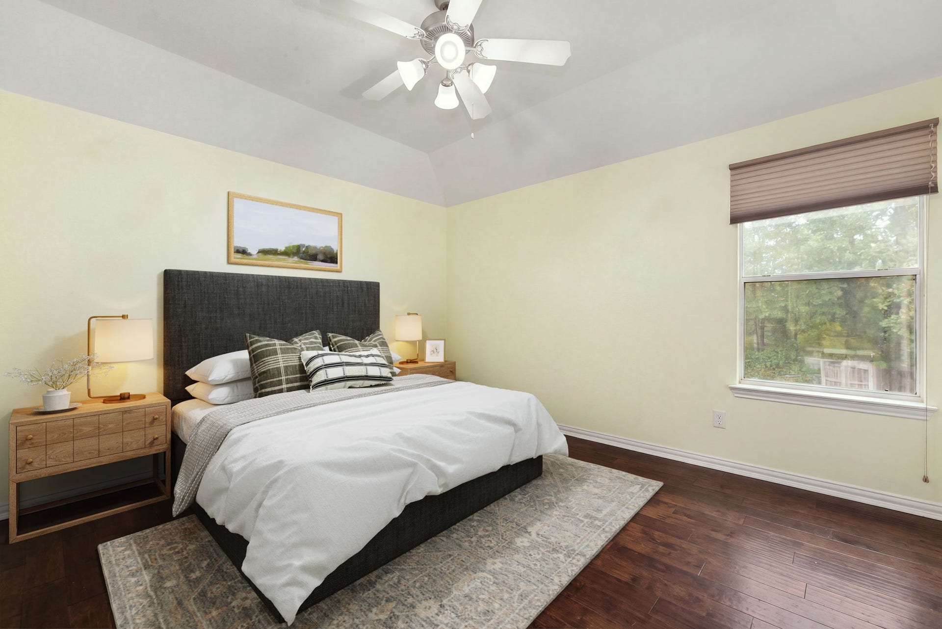 4110 Garden Cove Court, Katy, TX 77494 Perfect as a guest suite, secondary bedroom, or an extra hobby room, this space boasts elegant tray ceilings, a modern light-integrated ceiling fan, and soft neutral paint. The large window offers peaceful views of the surrounding greenery, completing a cozy and private layout.