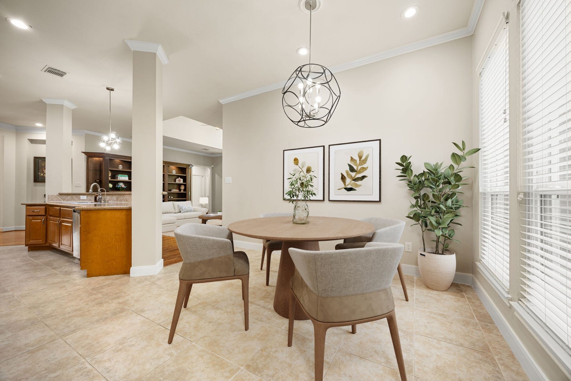 4110 Garden Cove Court, Katy, TX 77494 This sunlit breakfast nook sits right off the kitchen, serving as the perfect spot for casual morning coffee or family meals. Large windows fill the space with cheerful morning light, while a stylish, contemporary orb chandelier adds a chic, modern touch to your everyday dining experience.