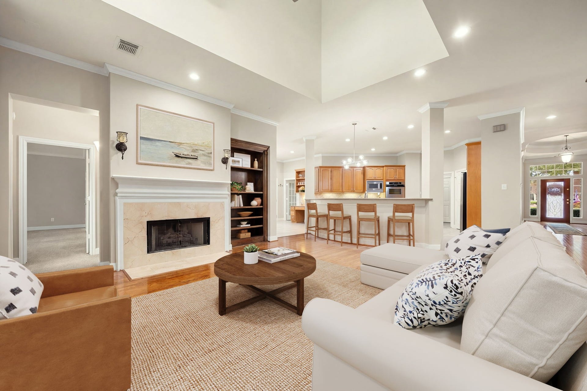 4110 Garden Cove Court, Katy, TX 77494 From this vantage point, you see the gorgeous modern fireplace surround, the soaring double-height architectural ceiling details, and the effortless, open pathway directly into the gourmet kitchen and formal dining spaces.