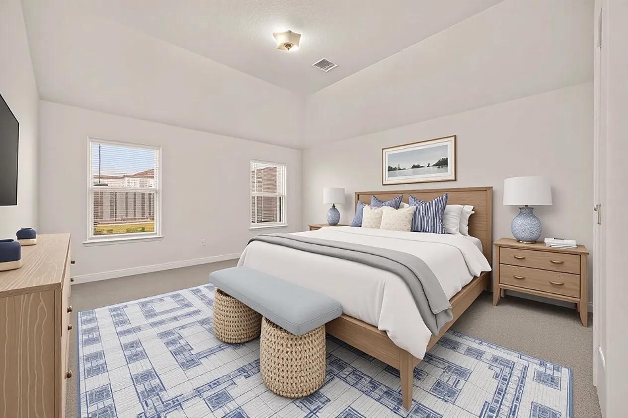 Spacious primary bed with natural lighting [virtually staged]